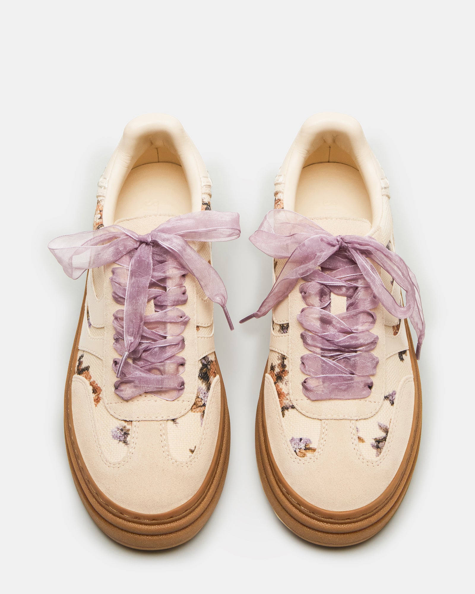 Close-up of the unique print on DODGE low top sneakers.