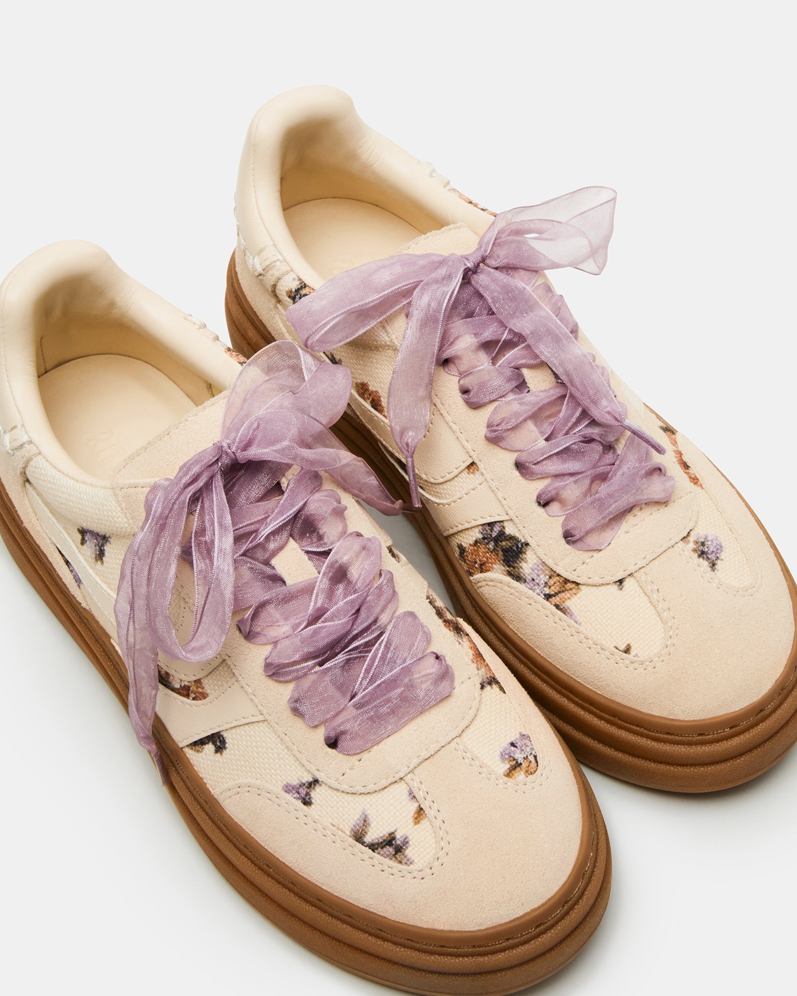 Side view of DODGE Floral Multi low top sneakers with beige laces.