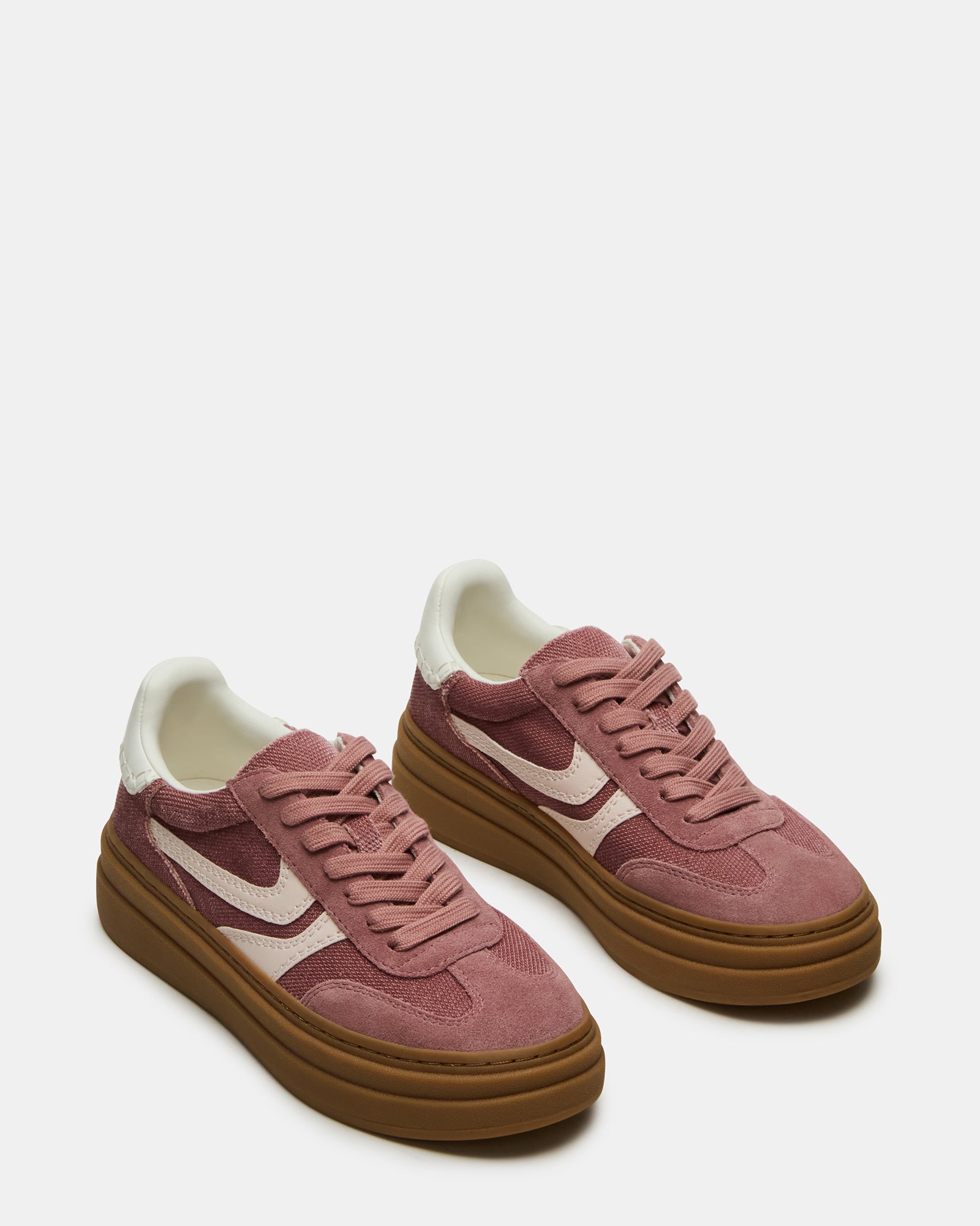 Close-up of suede and textile detailing on mens casual shoes in soft mauve colorway