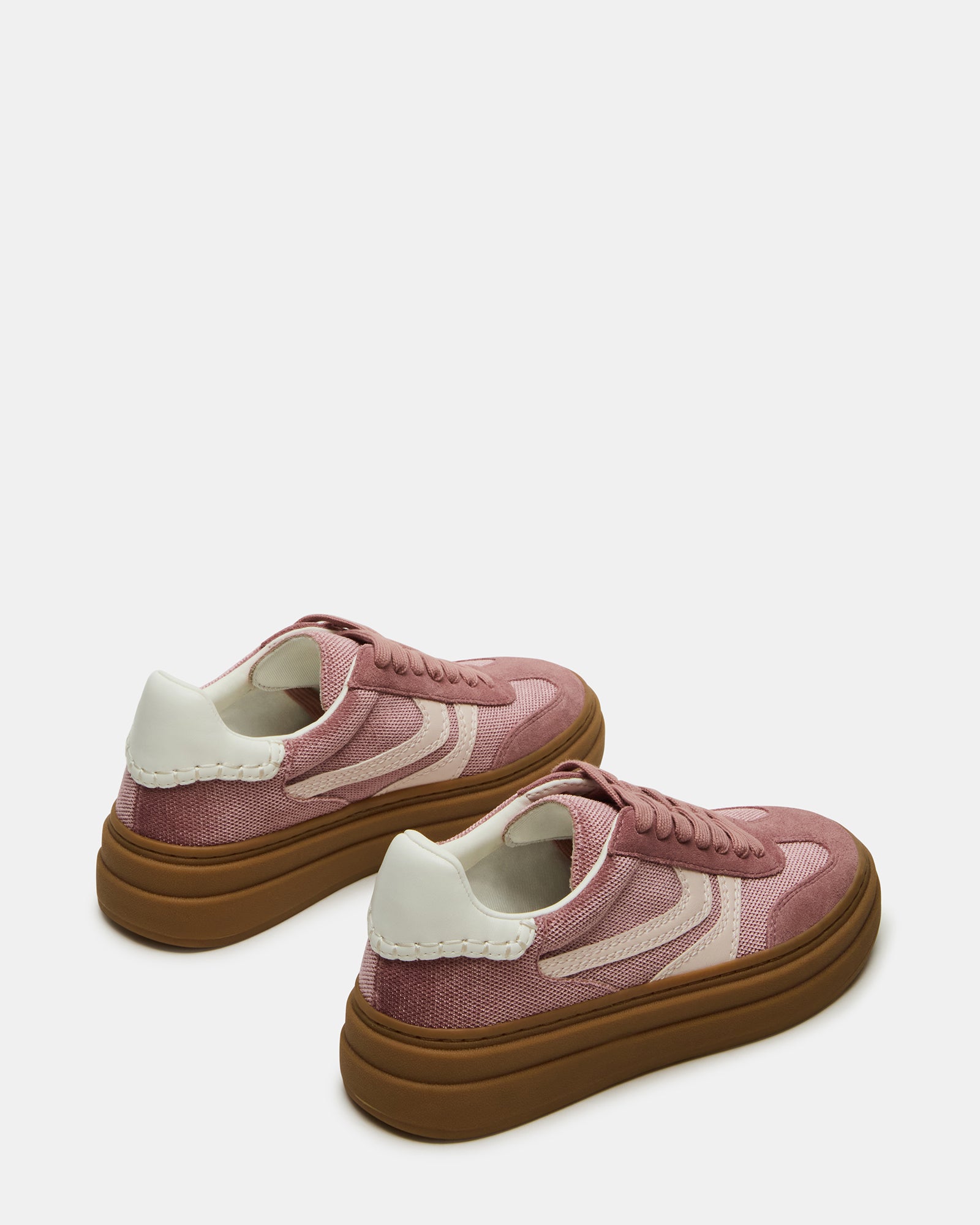 Close-up of suede and textile detailing on mens casual shoes in soft mauve colorway