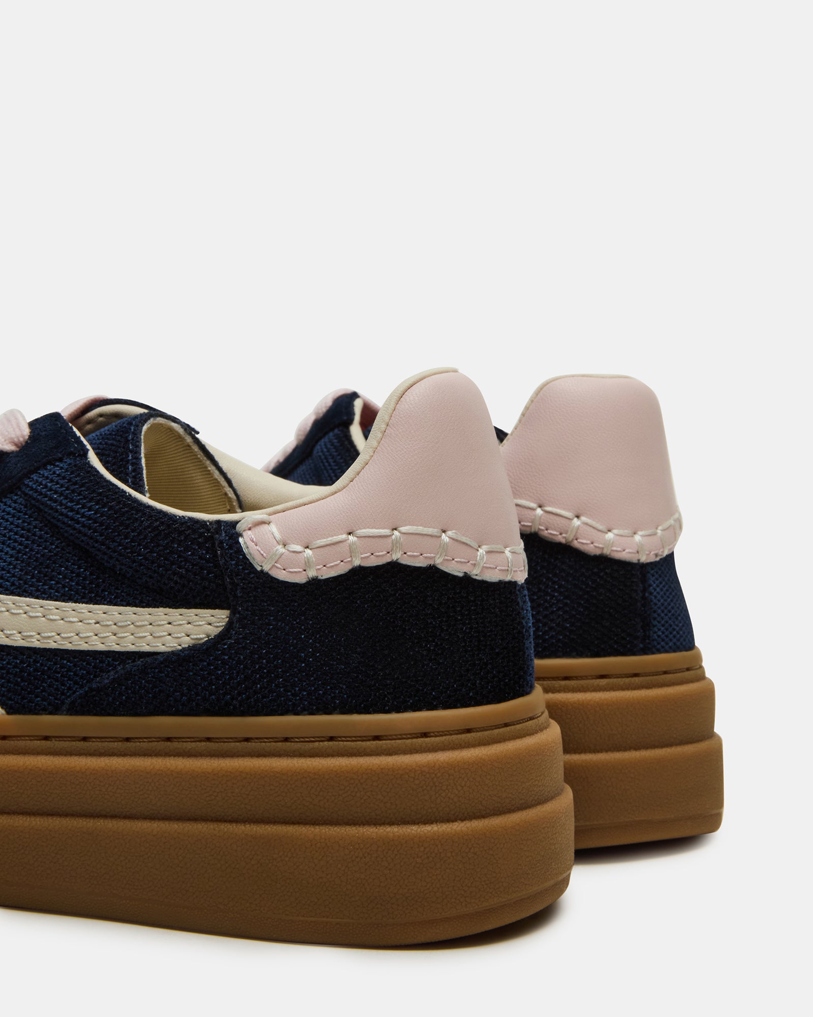 Dodge Navy Bottega Sneakers worn in a casual setting.
