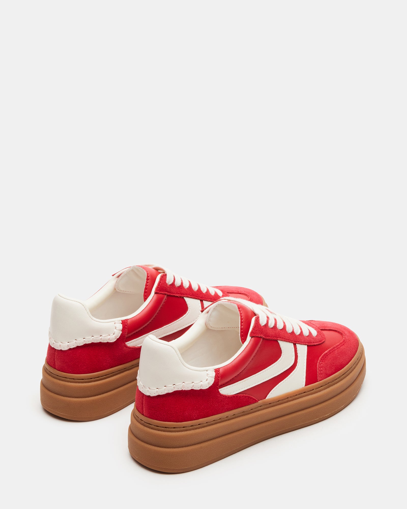 Dodge sneakers paired with chinos for a business casual ensemble