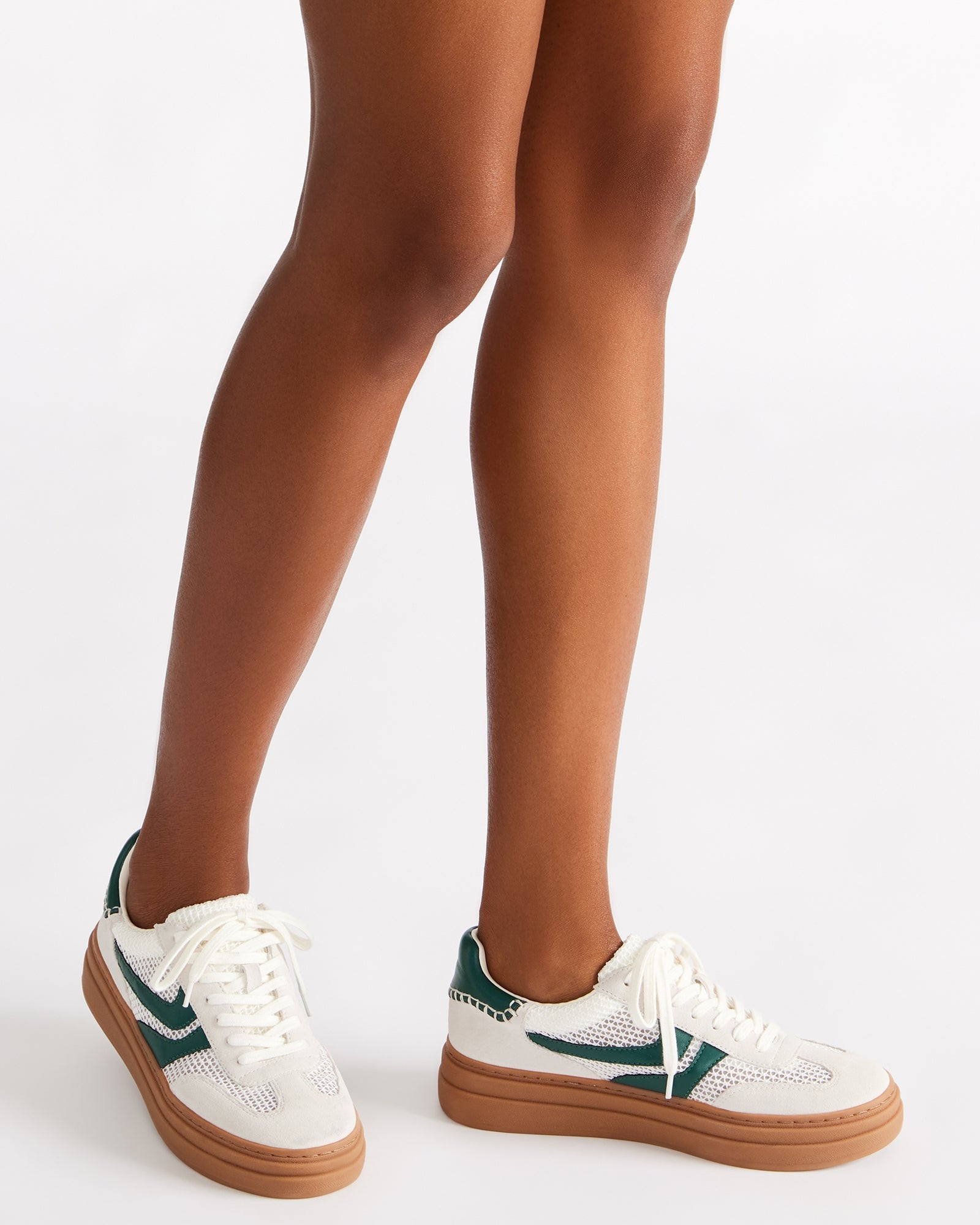 Side view of Bottega low-top shoes highlighting the textured suede and textile upper