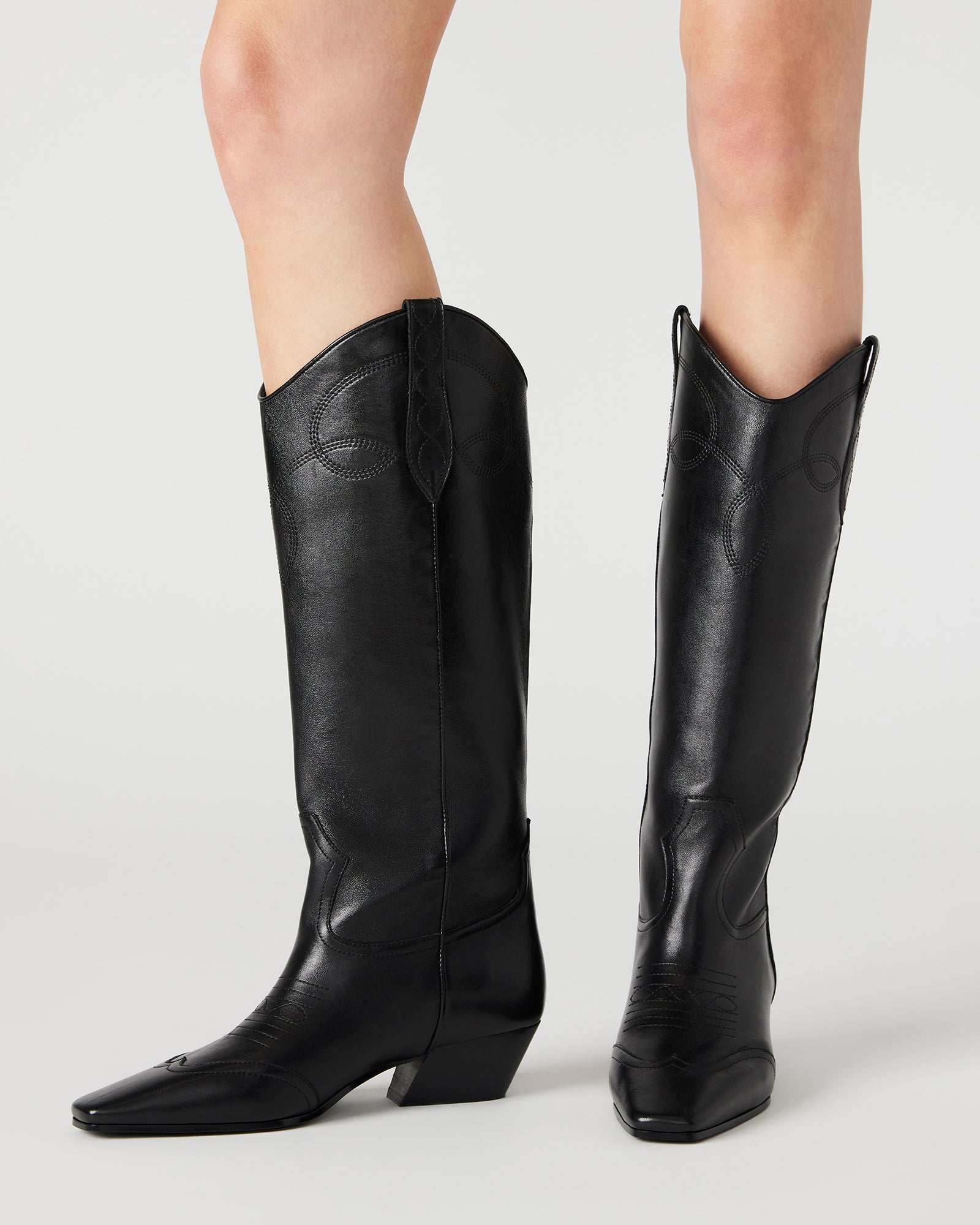 Close-up of the square toe design on Dollie black leather boots.