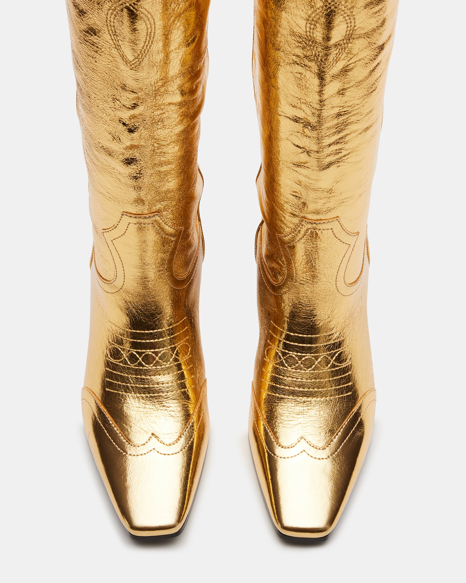 Dollie gold leather Western boots from a side profile, showcasing the square toe and heel.