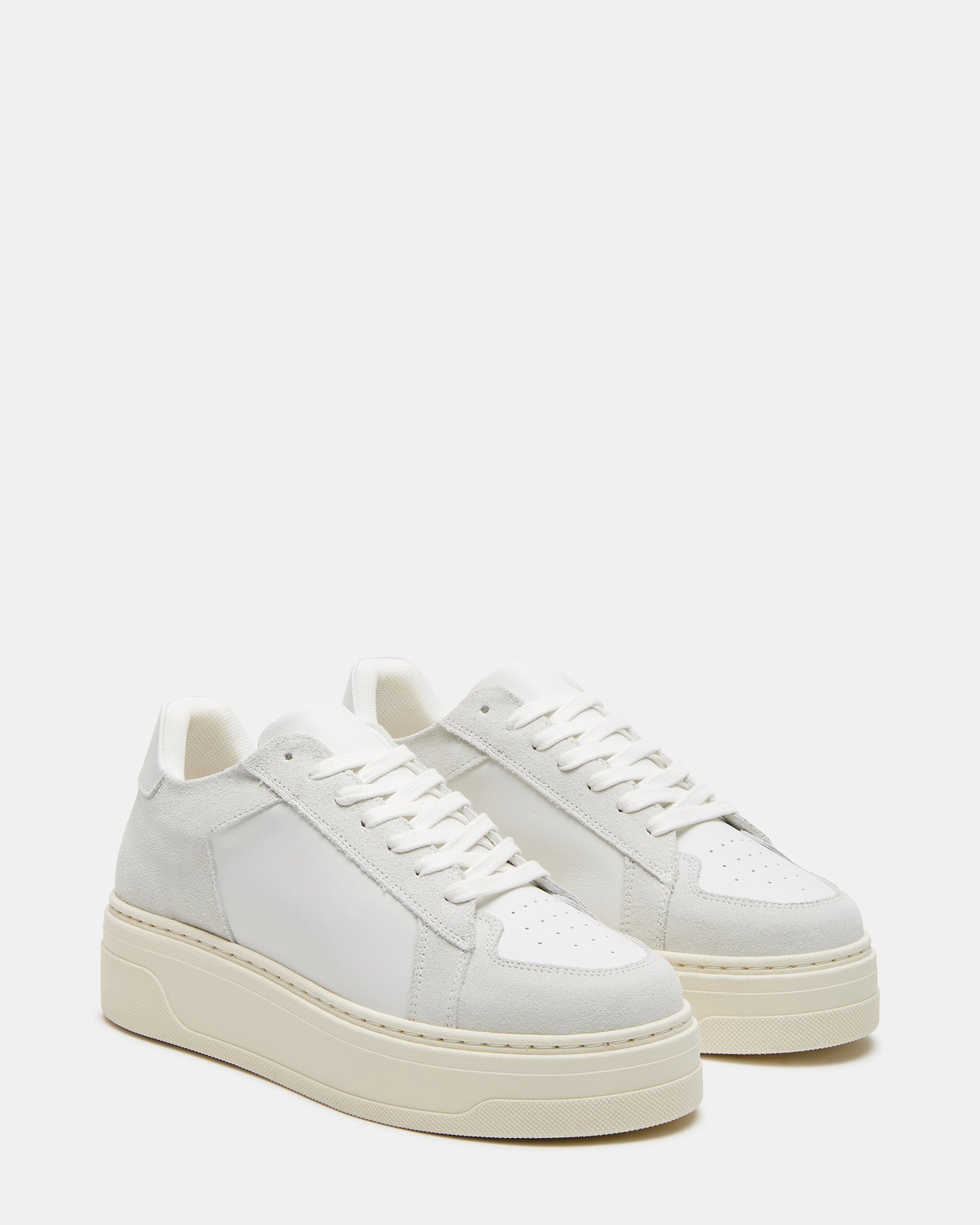 Side view of the stylish white platform sneaker showing the 1.5 inch heel