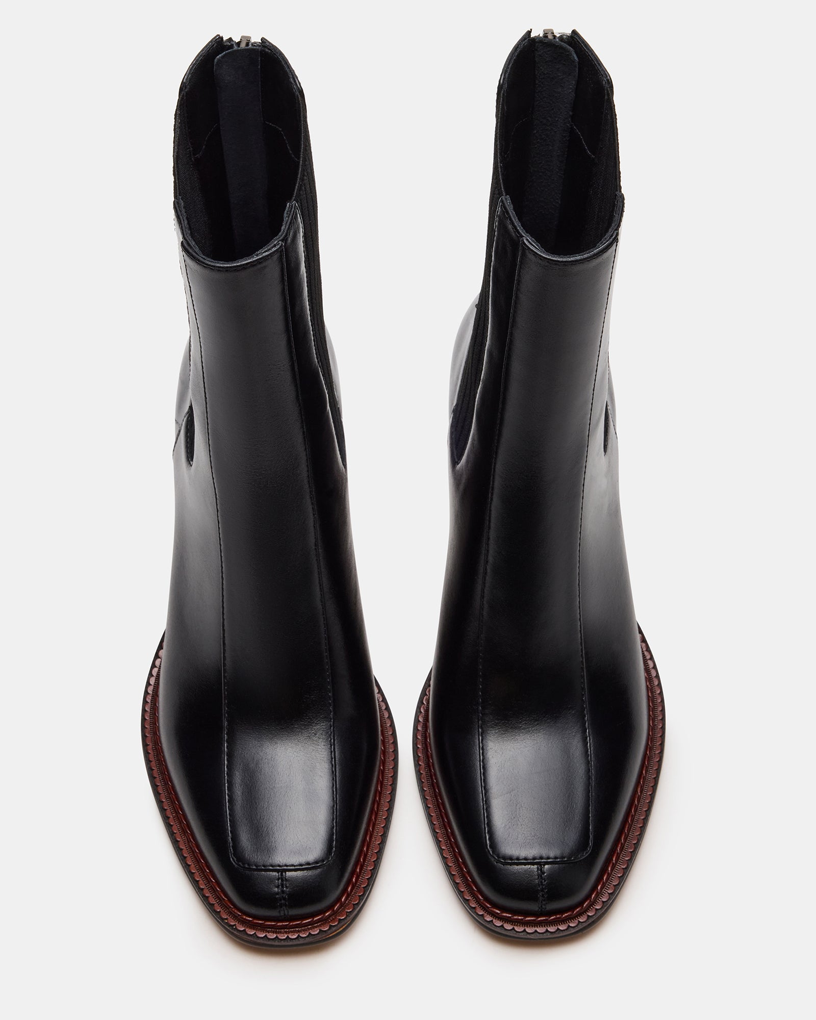 Side view of black leather Chelsea boots with stacked heel, perfect for everyday fashion