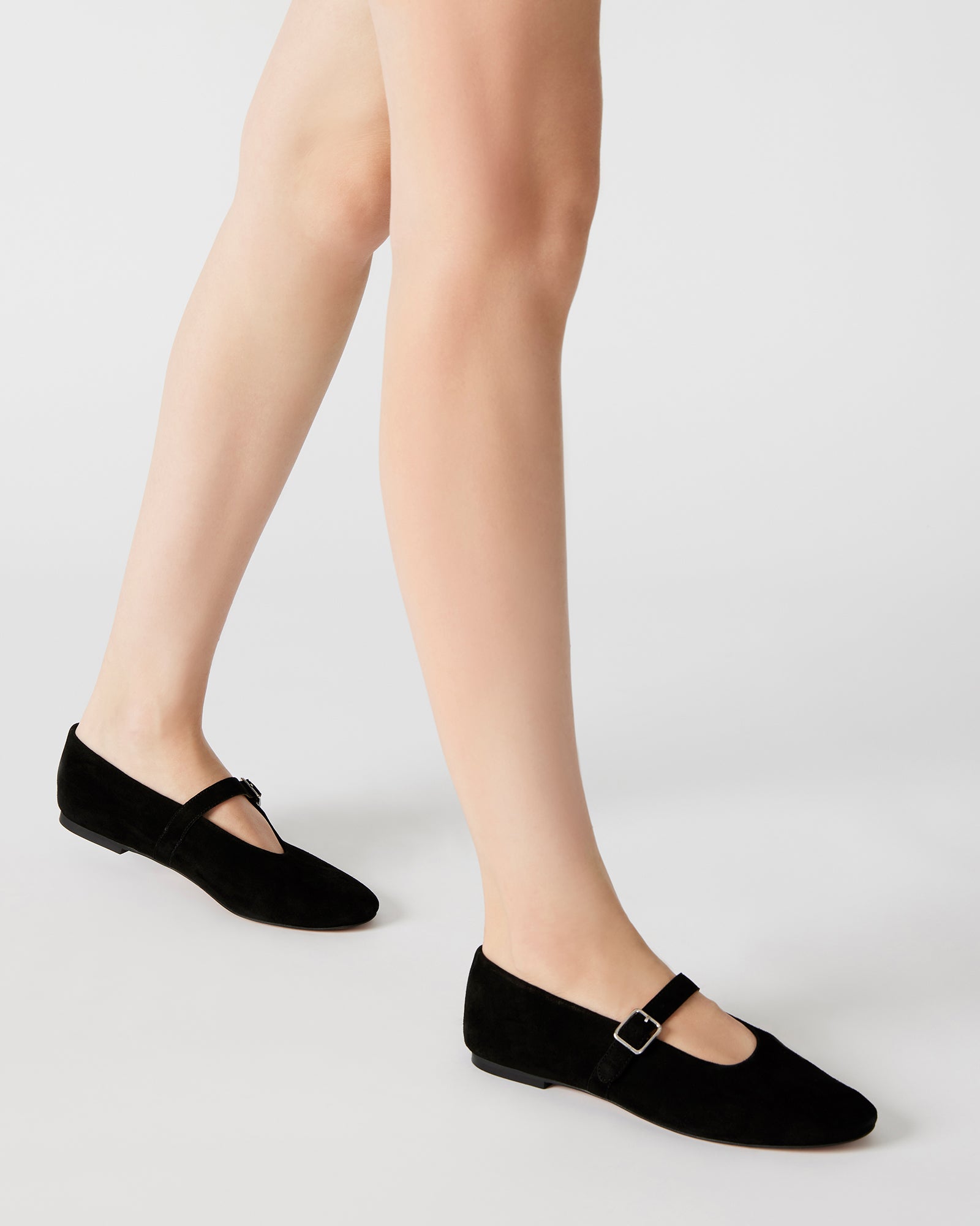 Side view of stylish black suede ballet flats ideal for casual outings.