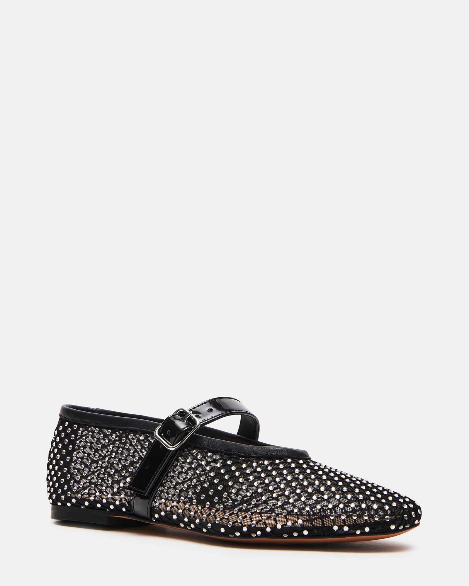 Pair of womens flats styled with dress pants, ideal for urban strolls or office days