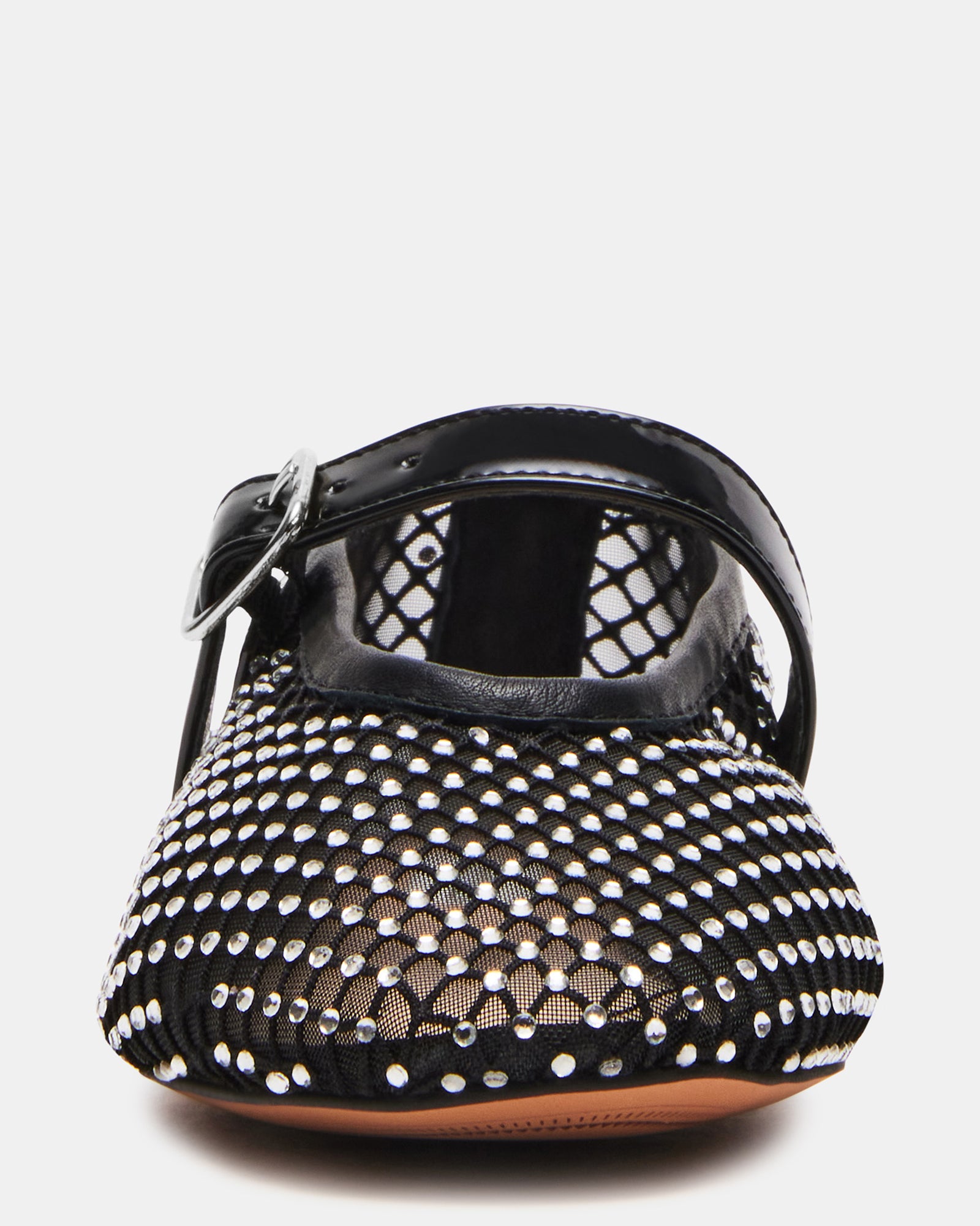 Close-up side view of black ballet flats showing mesh texture and slim silhouette