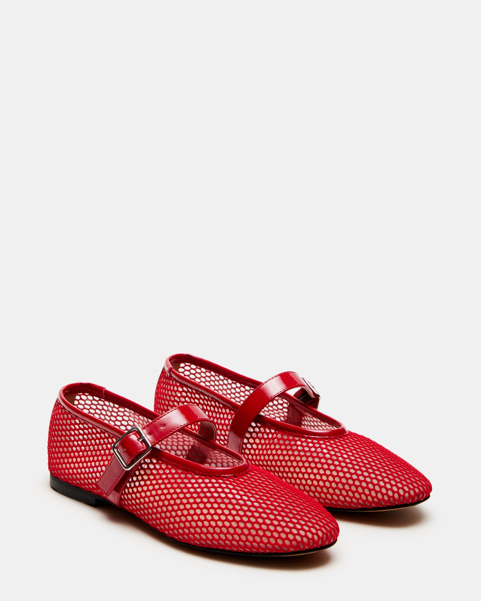 Close-up of mary jane style red ballet flats with flat sole.