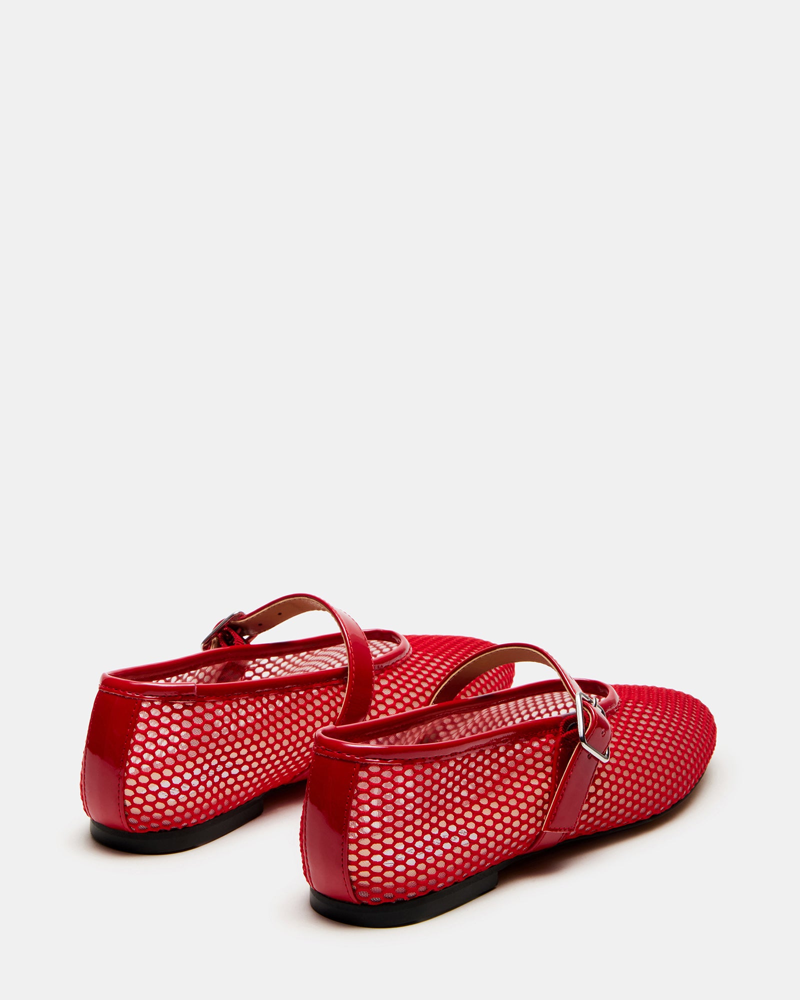 Close-up of mary jane style red ballet flats with flat sole.