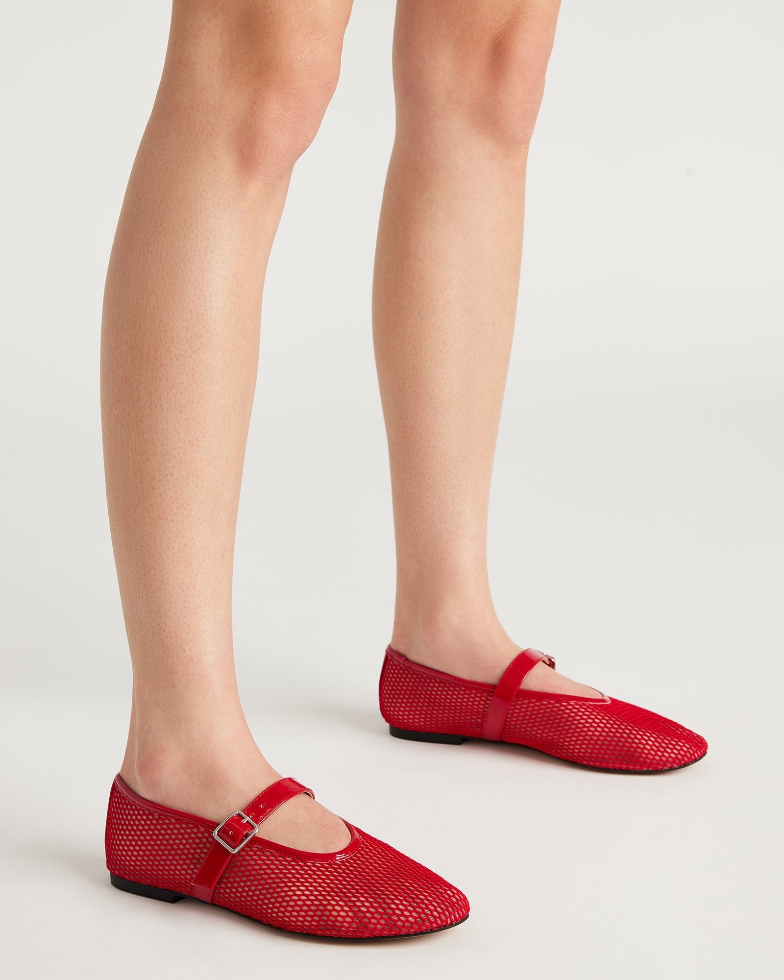 Top view of stylish red ballet flats suitable for daily wear.