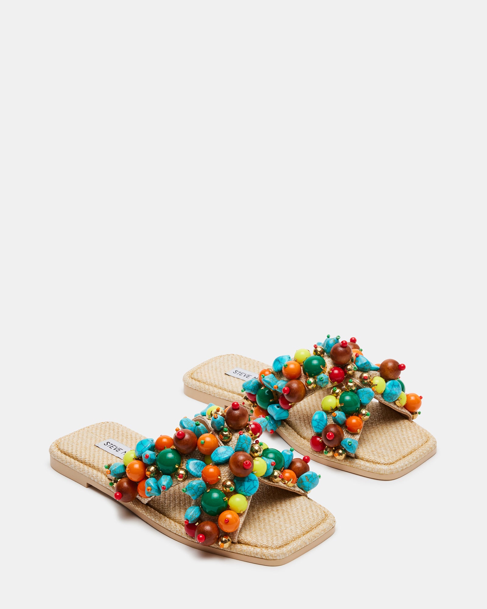 Close-up of ornamented raffia texture on the crossed straps, perfect for warm-weather occasions
