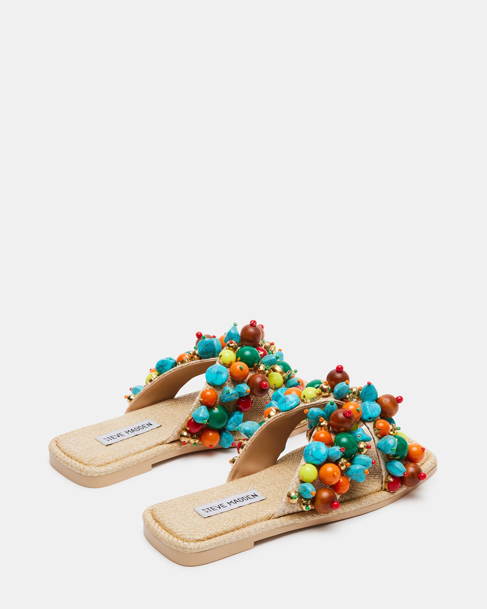 Close-up of ornamented raffia texture on the crossed straps, perfect for warm-weather occasions