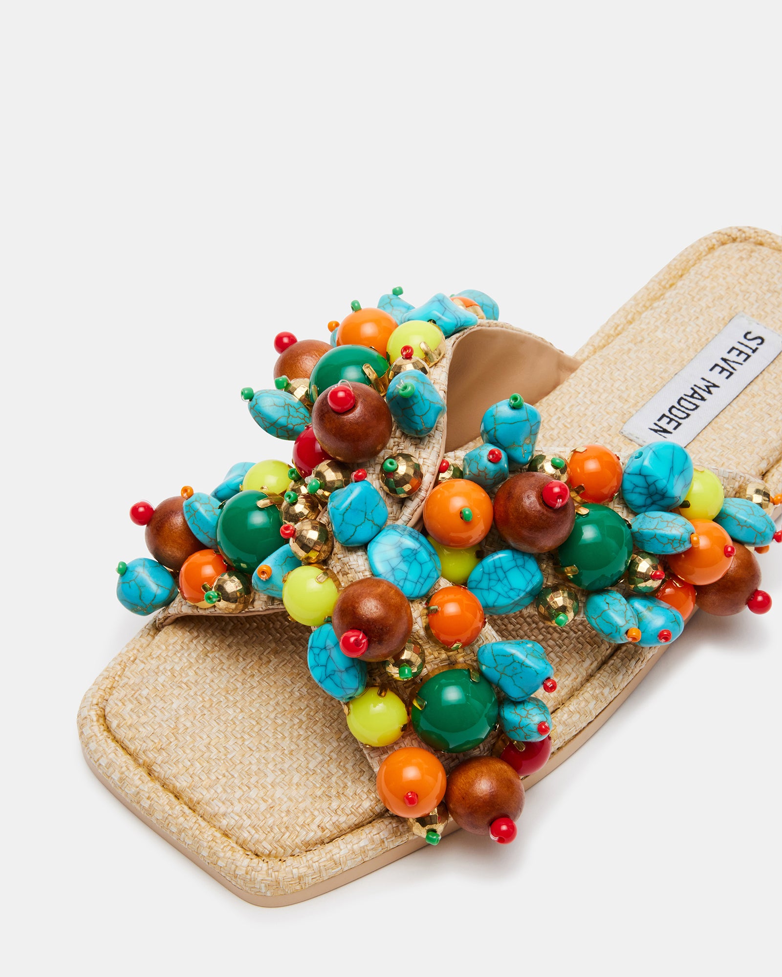 Top view of square toe sandals showing crisscross raffia straps with embellishments