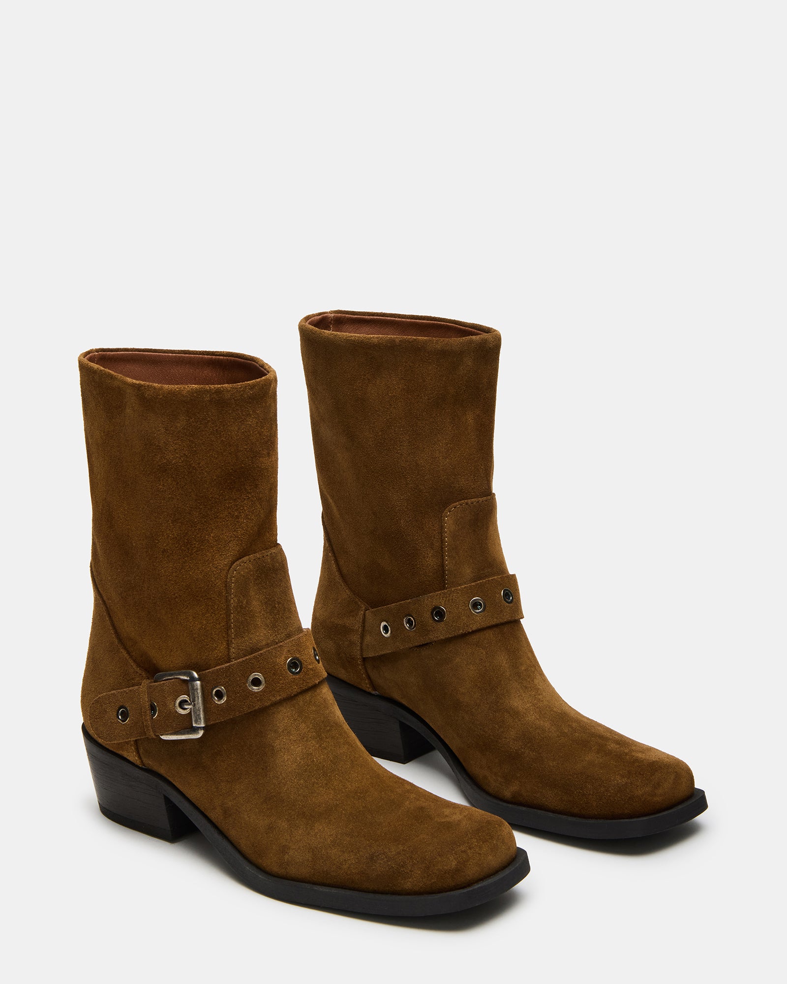 Close-up of square toe and buckle detail on boots