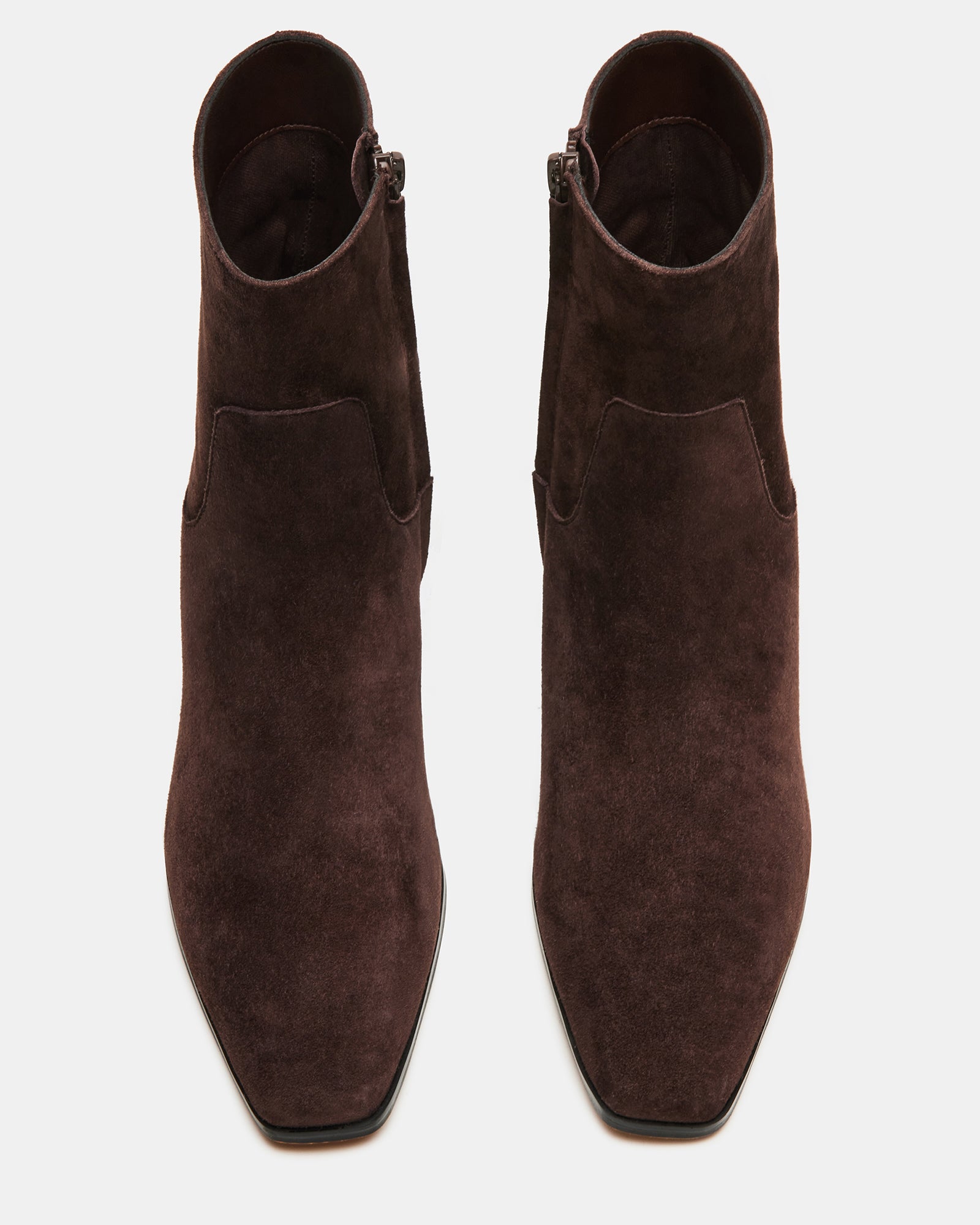 Close-up of the suede material on dusty chocolate ankle boots.