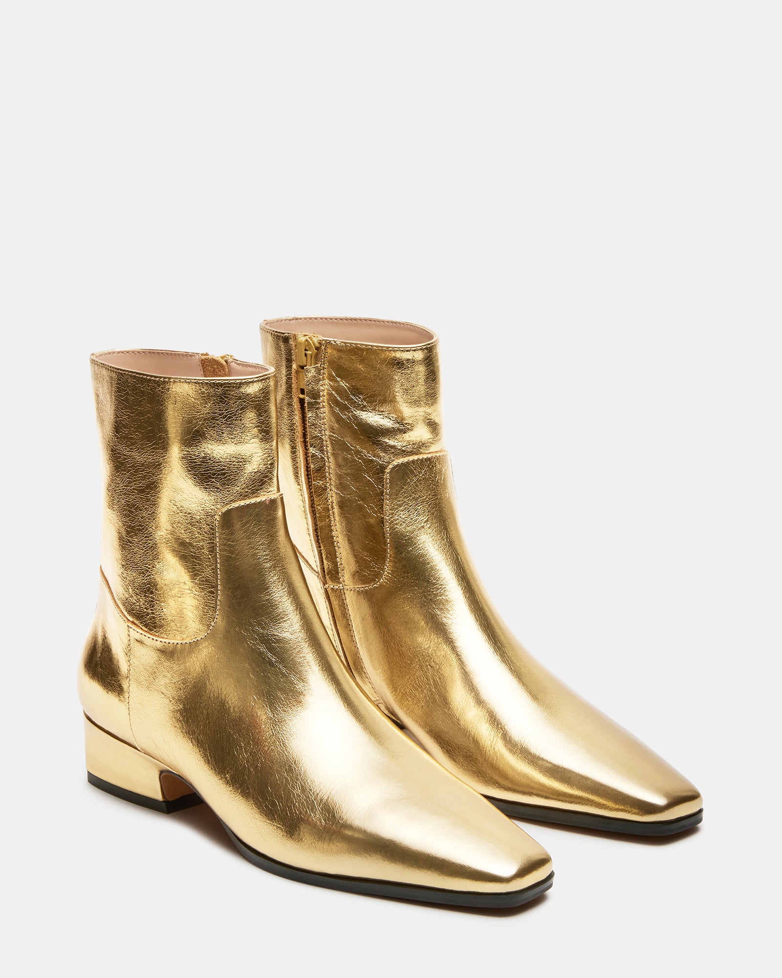 Fashionable Dusty Gold leather ankle boots paired with casual outfit