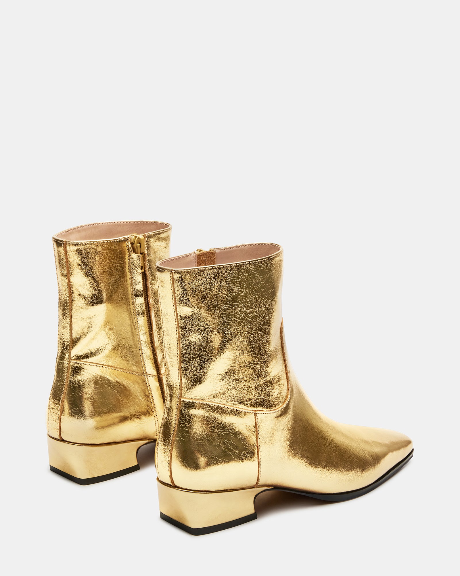 Fashionable Dusty Gold leather ankle boots paired with casual outfit