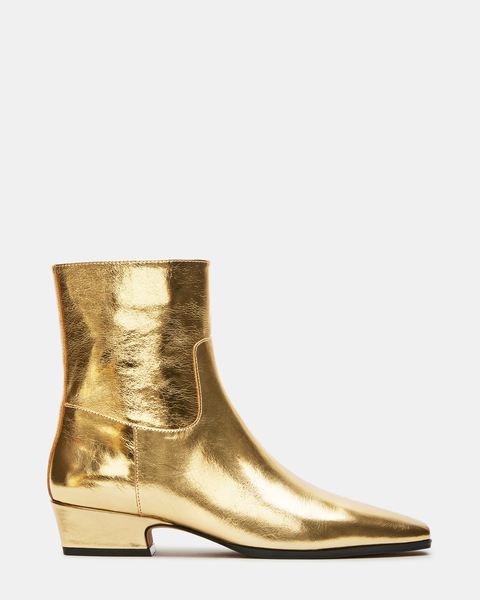 Dusty Gold leather ankle boots with square toe on a city street