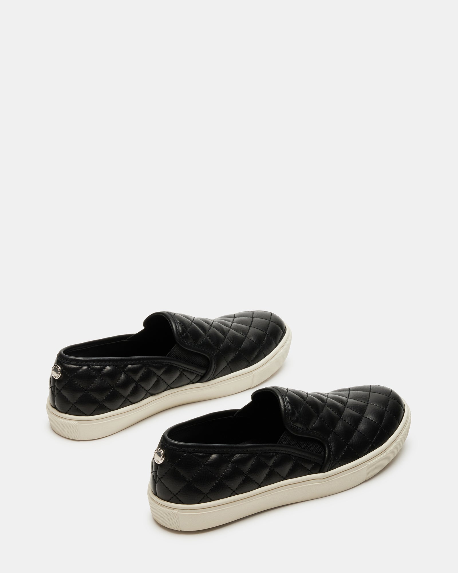 Close-up of vegan leather texture on slip-on sneakers.