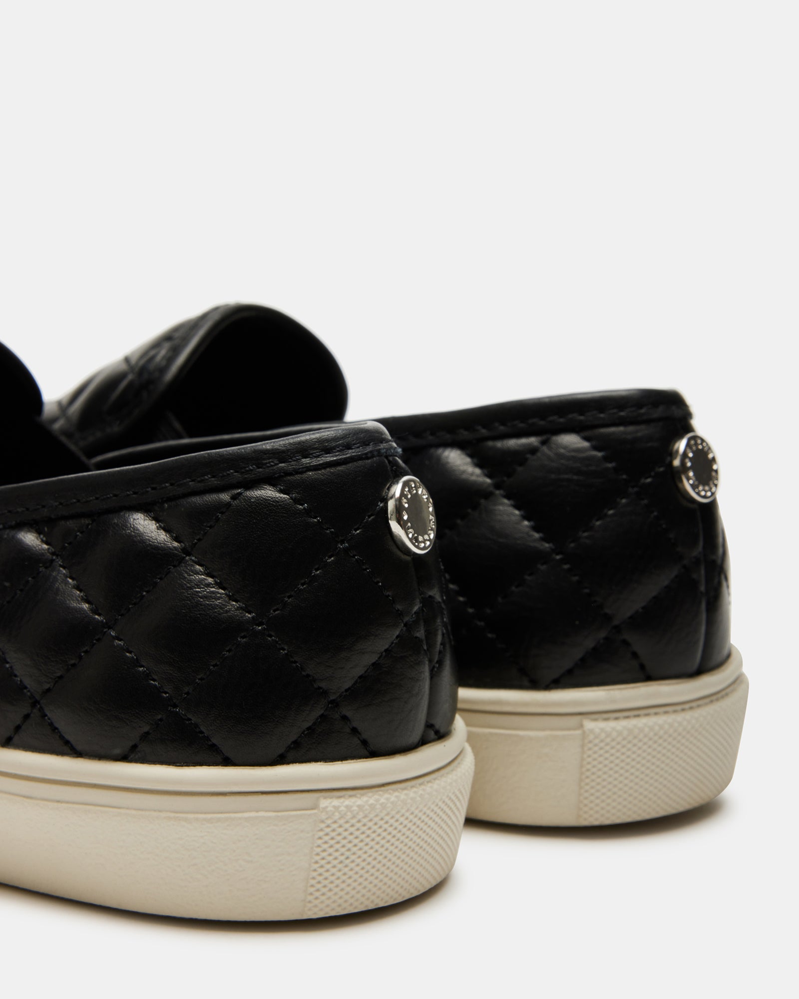 Outfit pairing: sneakers with distressed jeans and a white tee, urban style.
