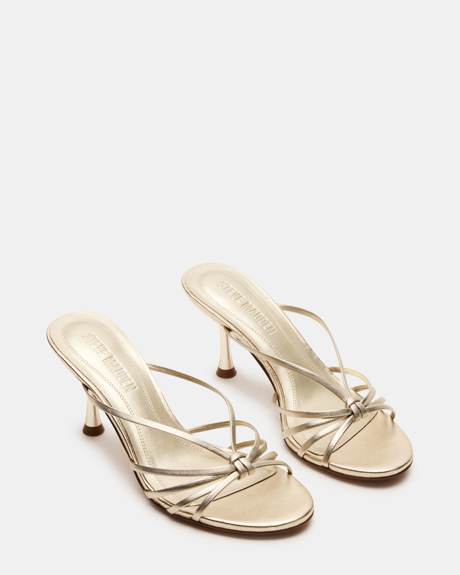 Fashionable scene of the champagne leather heels paired with a chic outfit for a night out