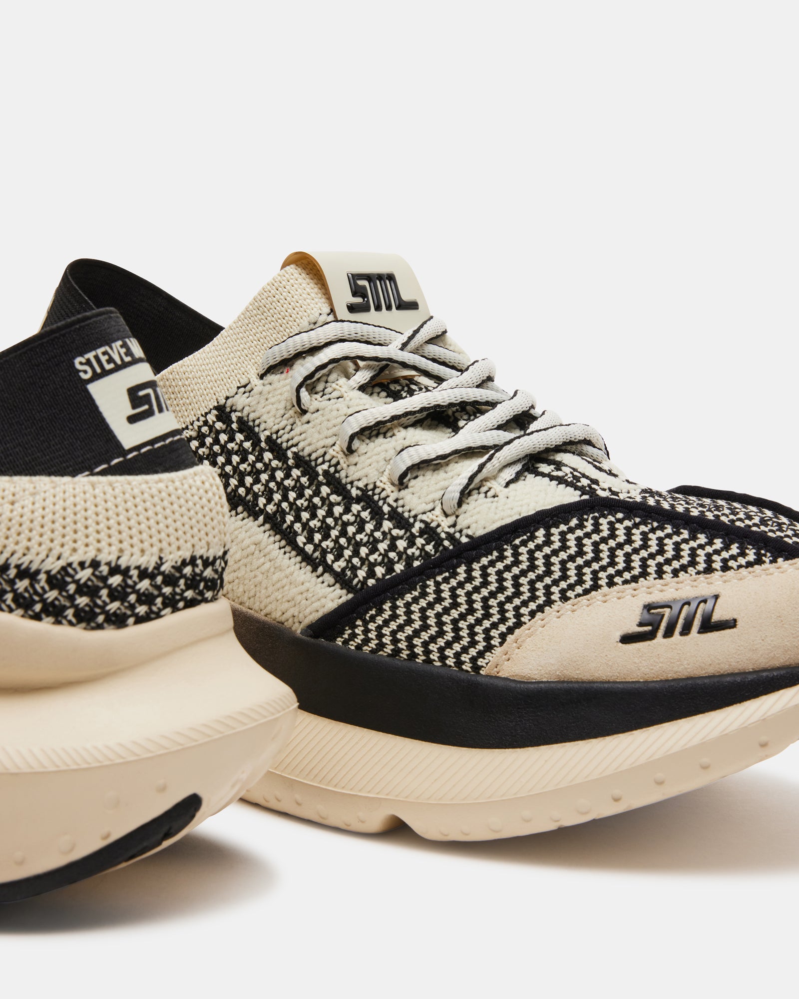 Detail shot of textile upper and synthetic sole on Elevate Beige sneakers