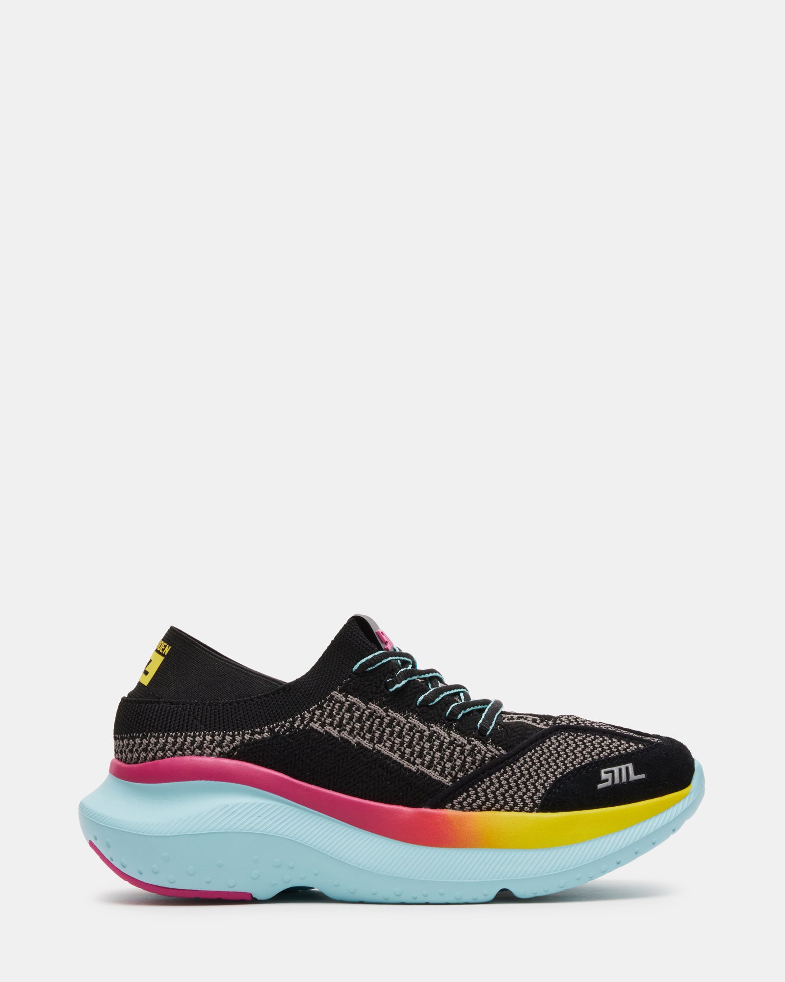 Close-up of black platform sneakers showcasing the modern knit upper and lace-up design.