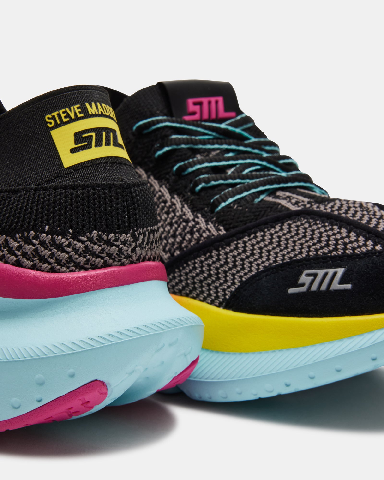 Side view of stylish black platform sneakers highlighting the 2-inch heel height.