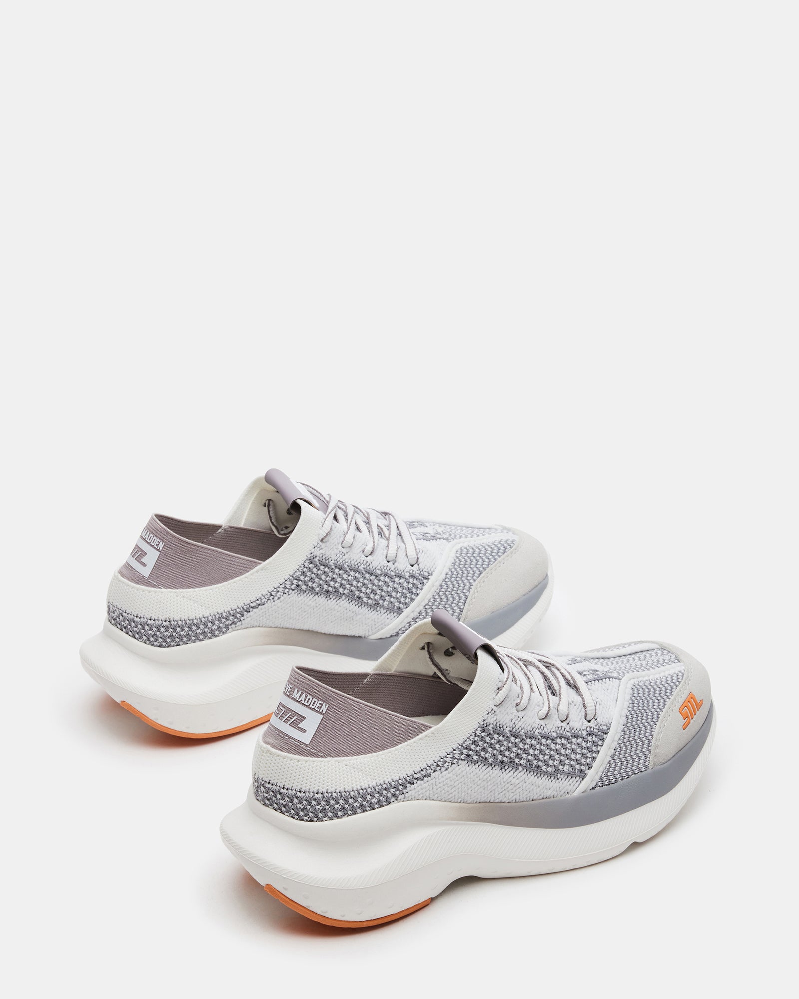 Side angle showcasing 2-inch heel and breathable textile of Elevate Silver