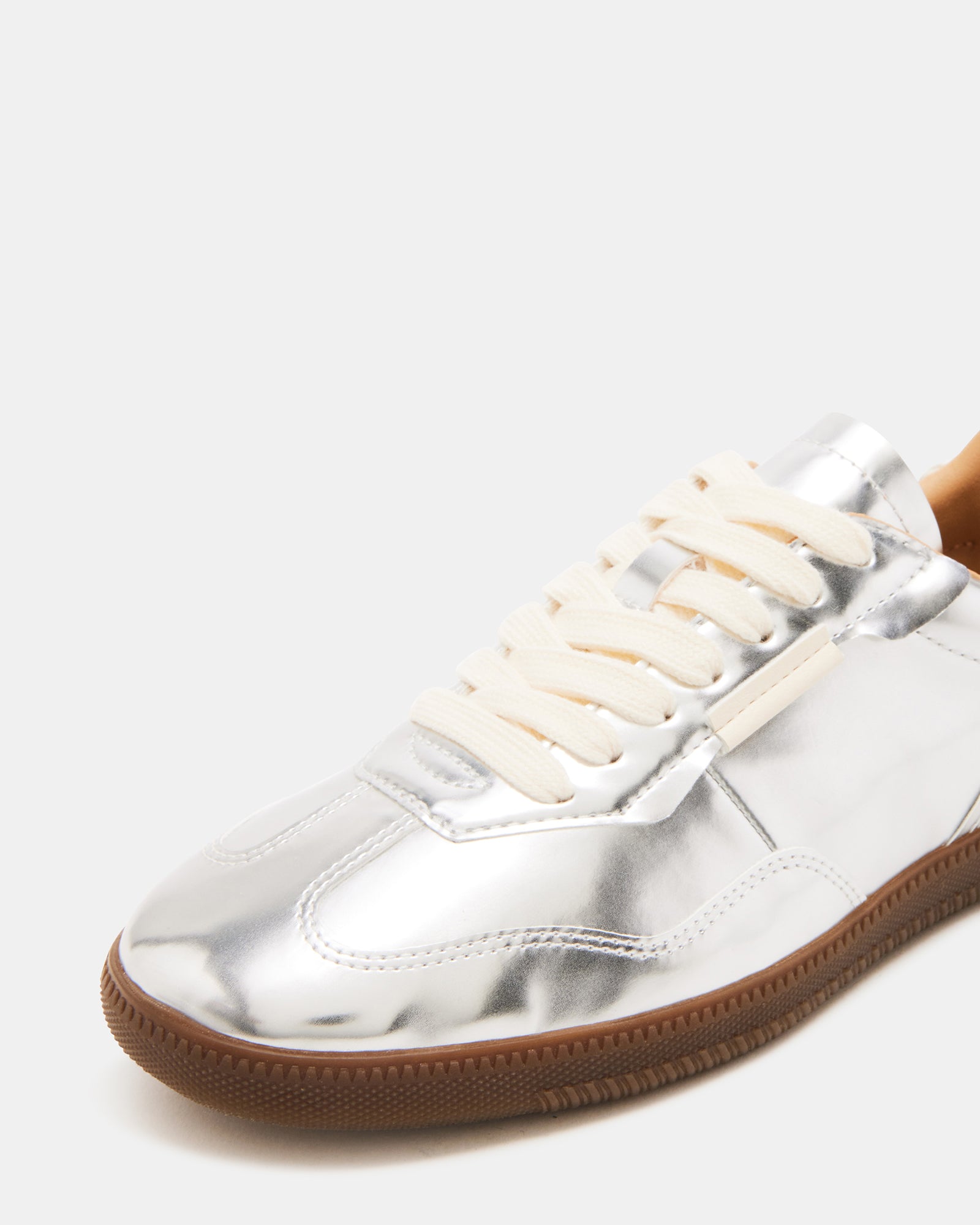 Close-up of laced closure on womens velvet sneakers.