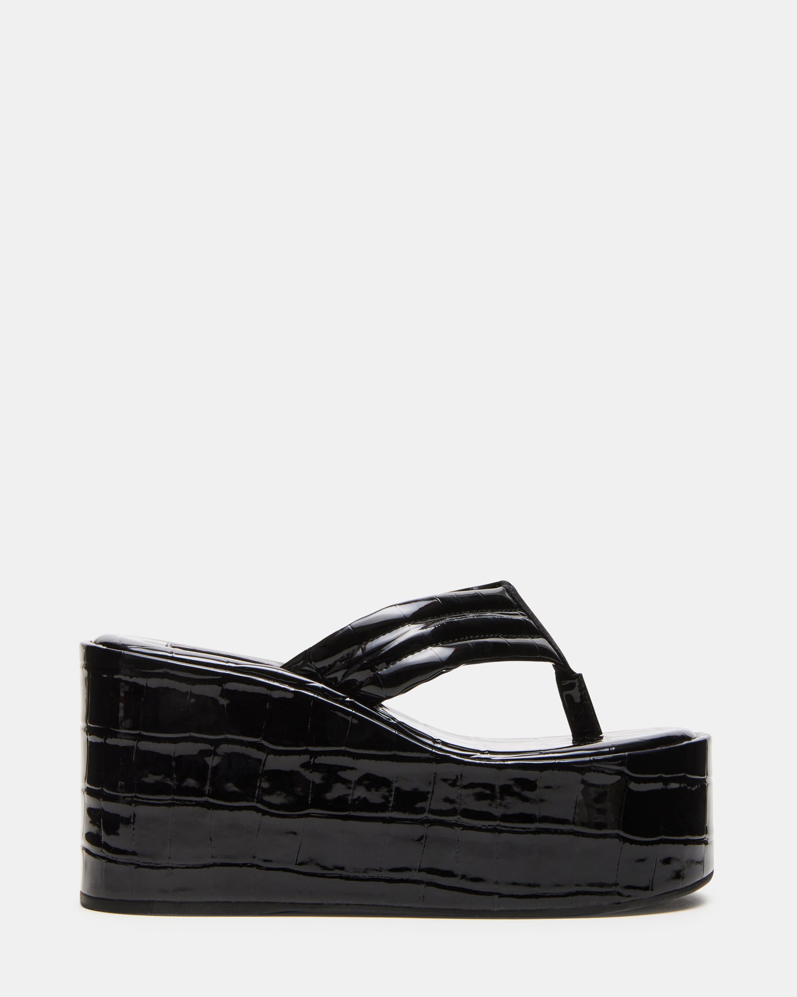 Side view of black platform sandals showcasing the sleek design.
