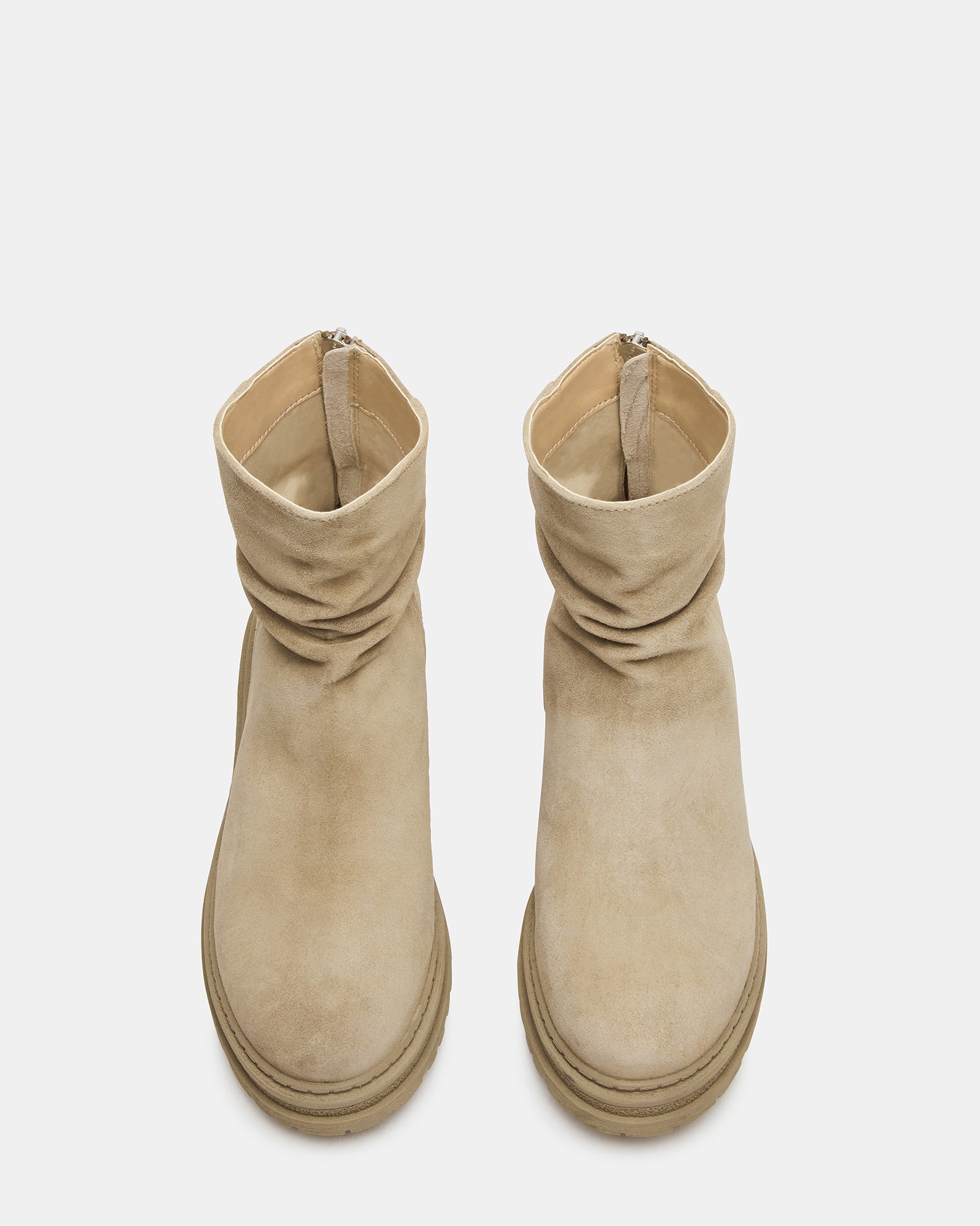 Side angle of taupe suede knee high boots showcasing scrunched design.