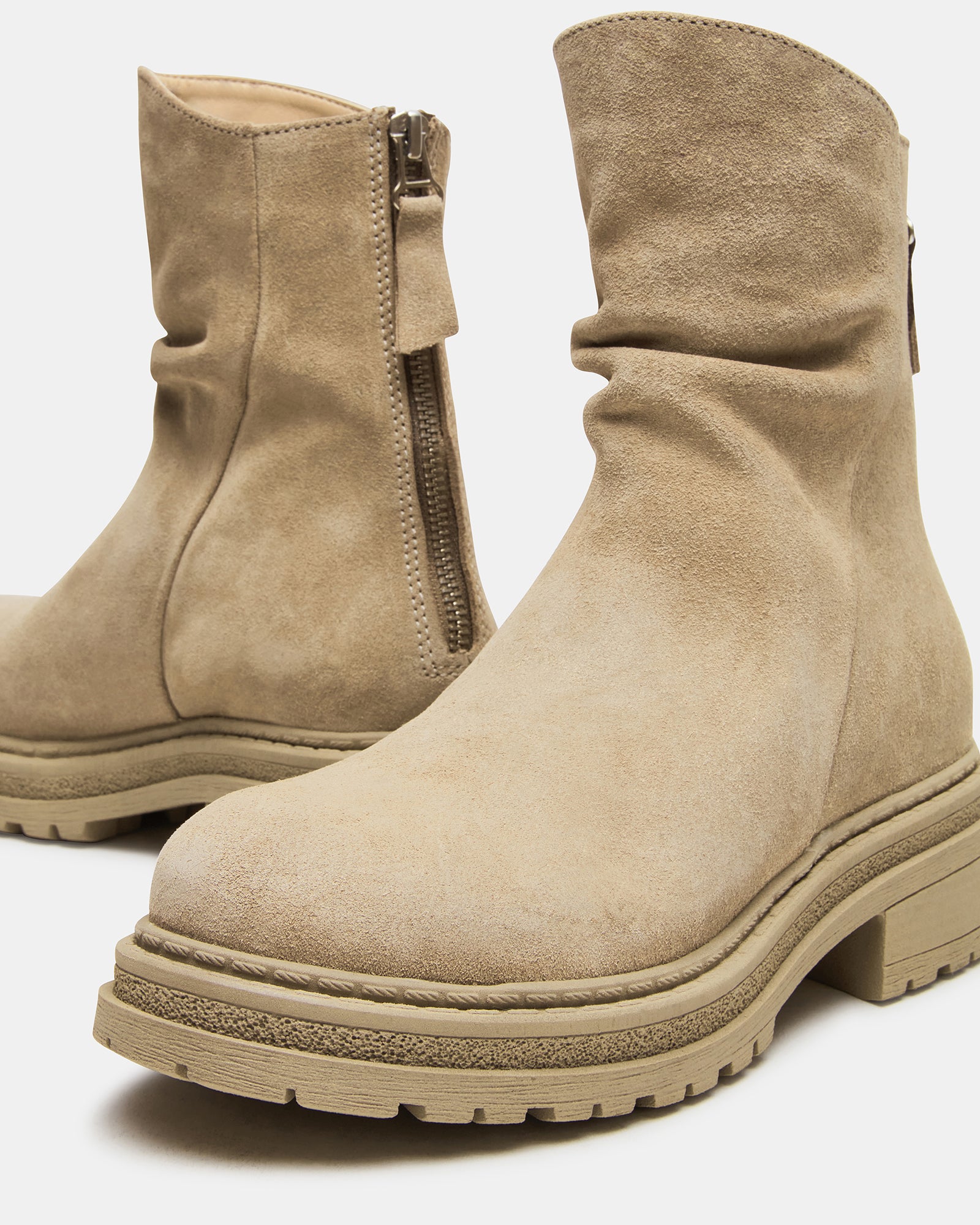 Full view of stylish taupe suede boots perfect for any outfit.