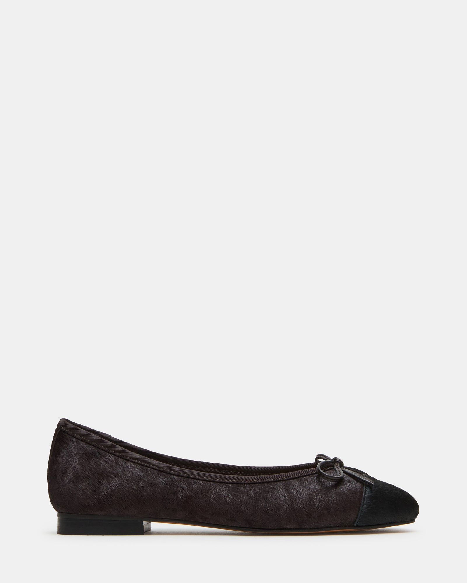 Black ballet flats with a side view showing the bow detail.