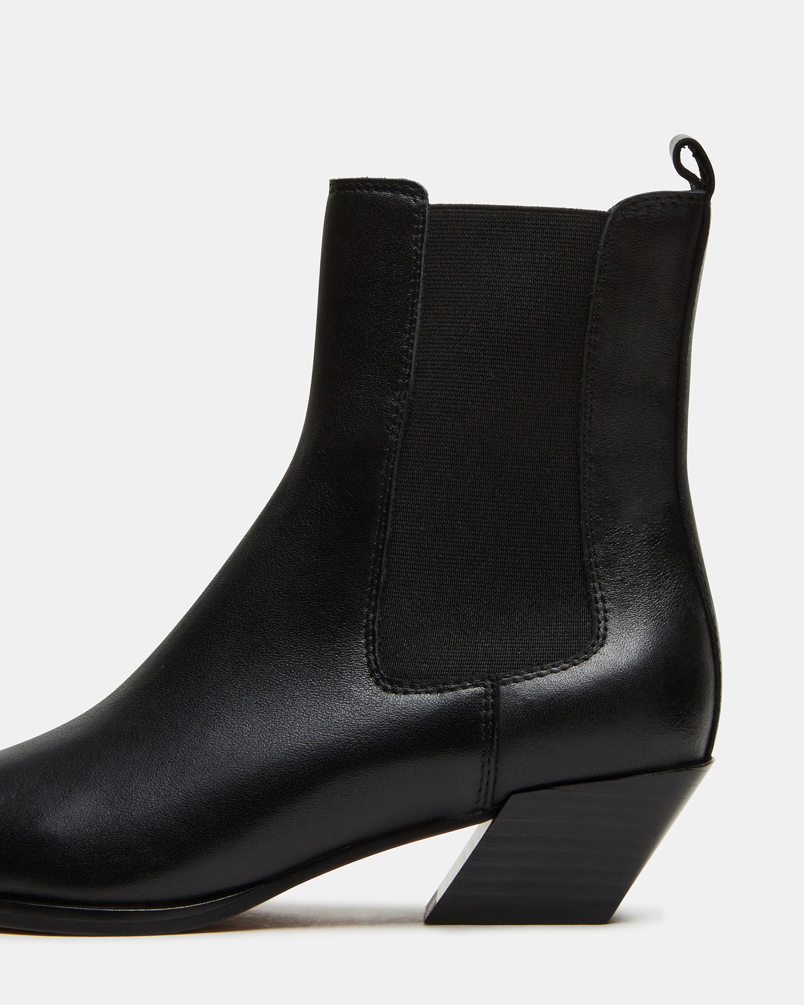 Womens ankle boots paired with a midi dress for a chic ensemble.