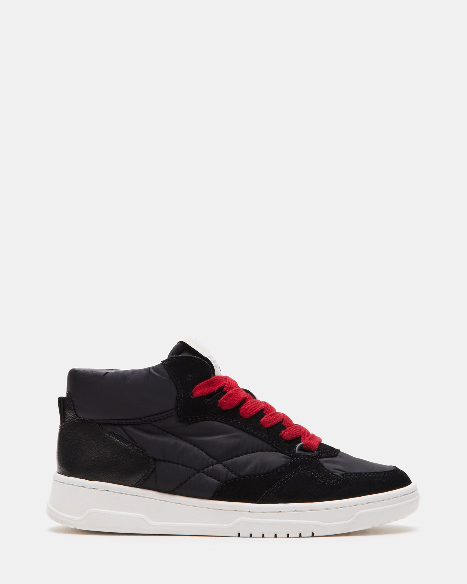 Everett Black Multi platform sneakers on a city sidewalk