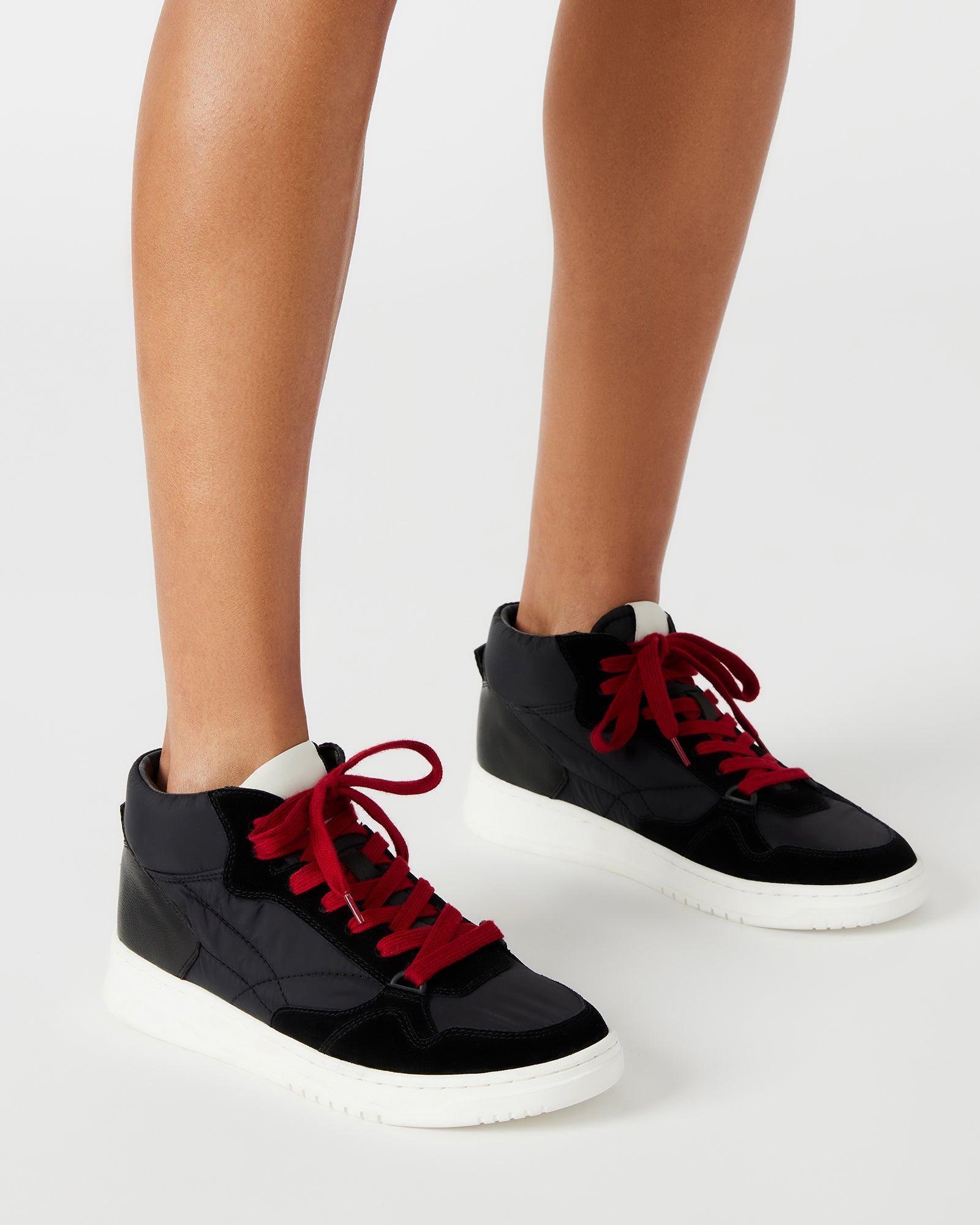 Close-up of D-ring lacing and perforated toe detail