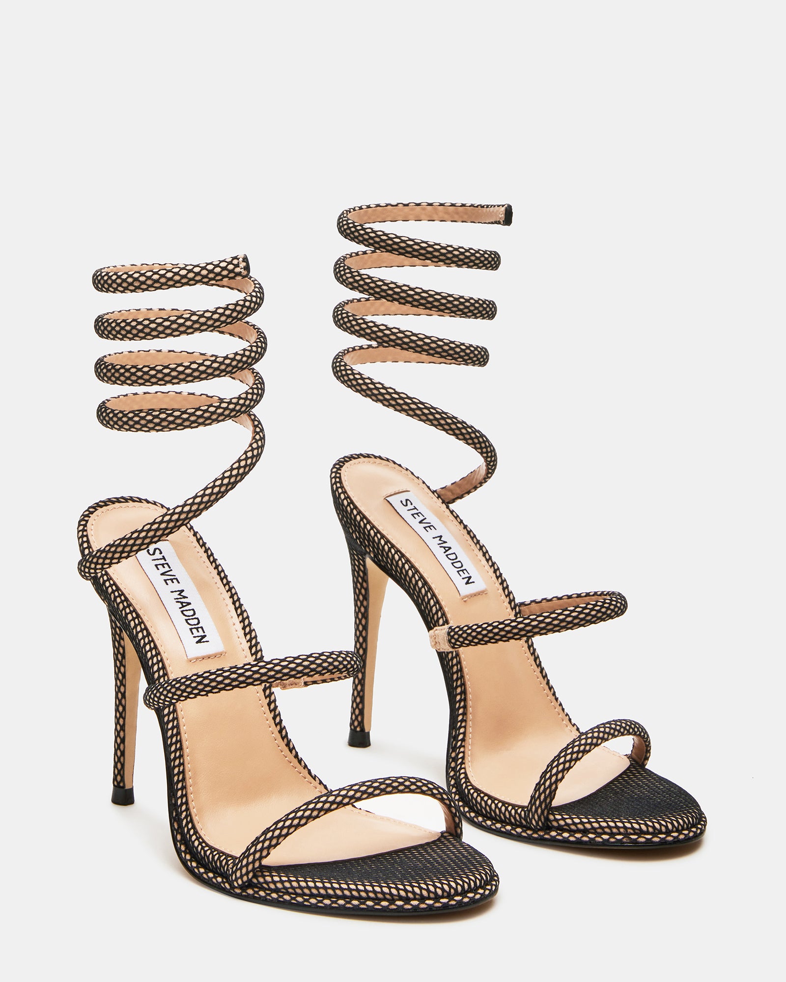 Front view of Exotica Luxe stiletto sandals on a models feet.
