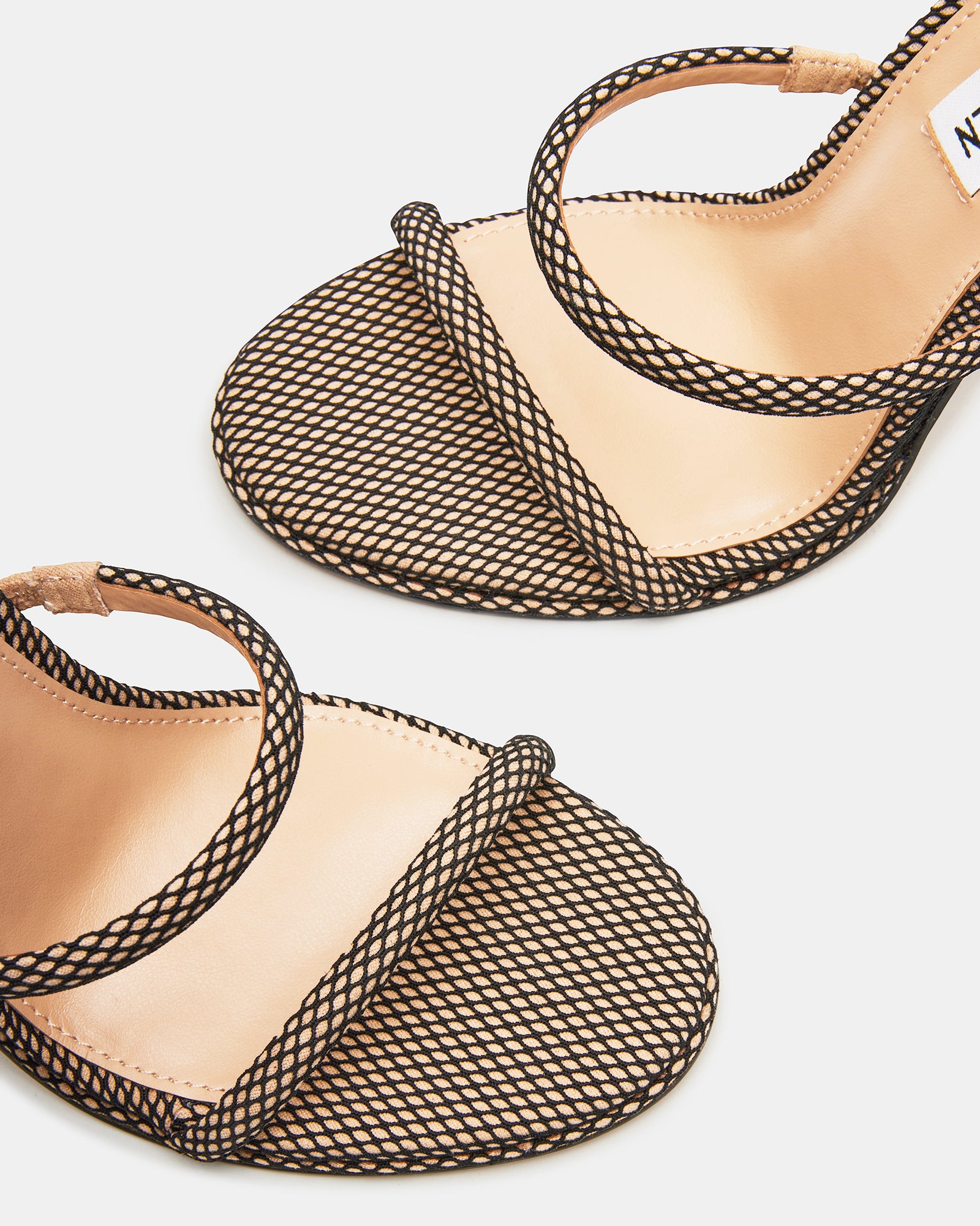 Charming Exotica Luxe sandals highlighting the ankle strap detail.