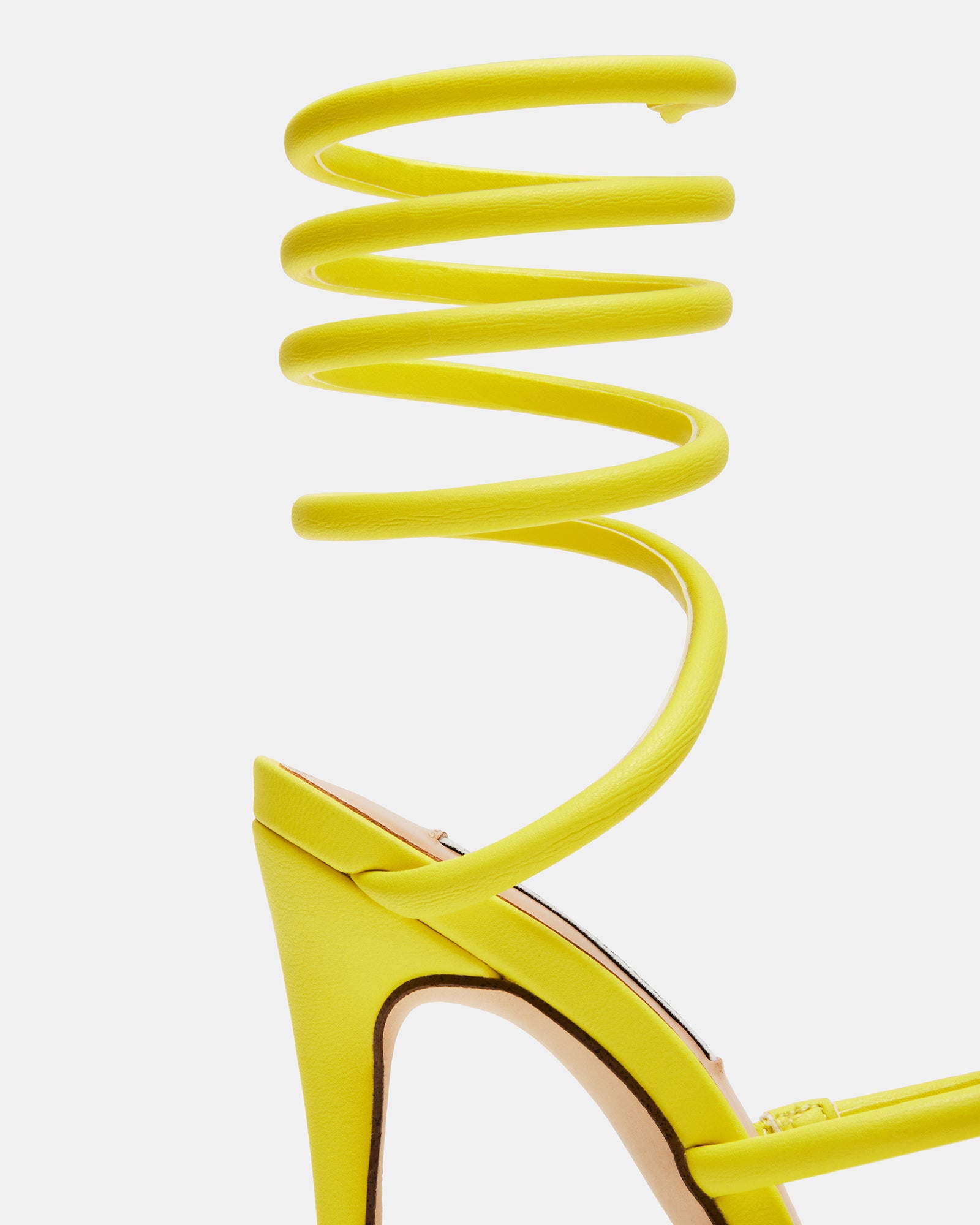 Lifestyle shot of male dress sandals and stiletto pair displayed together