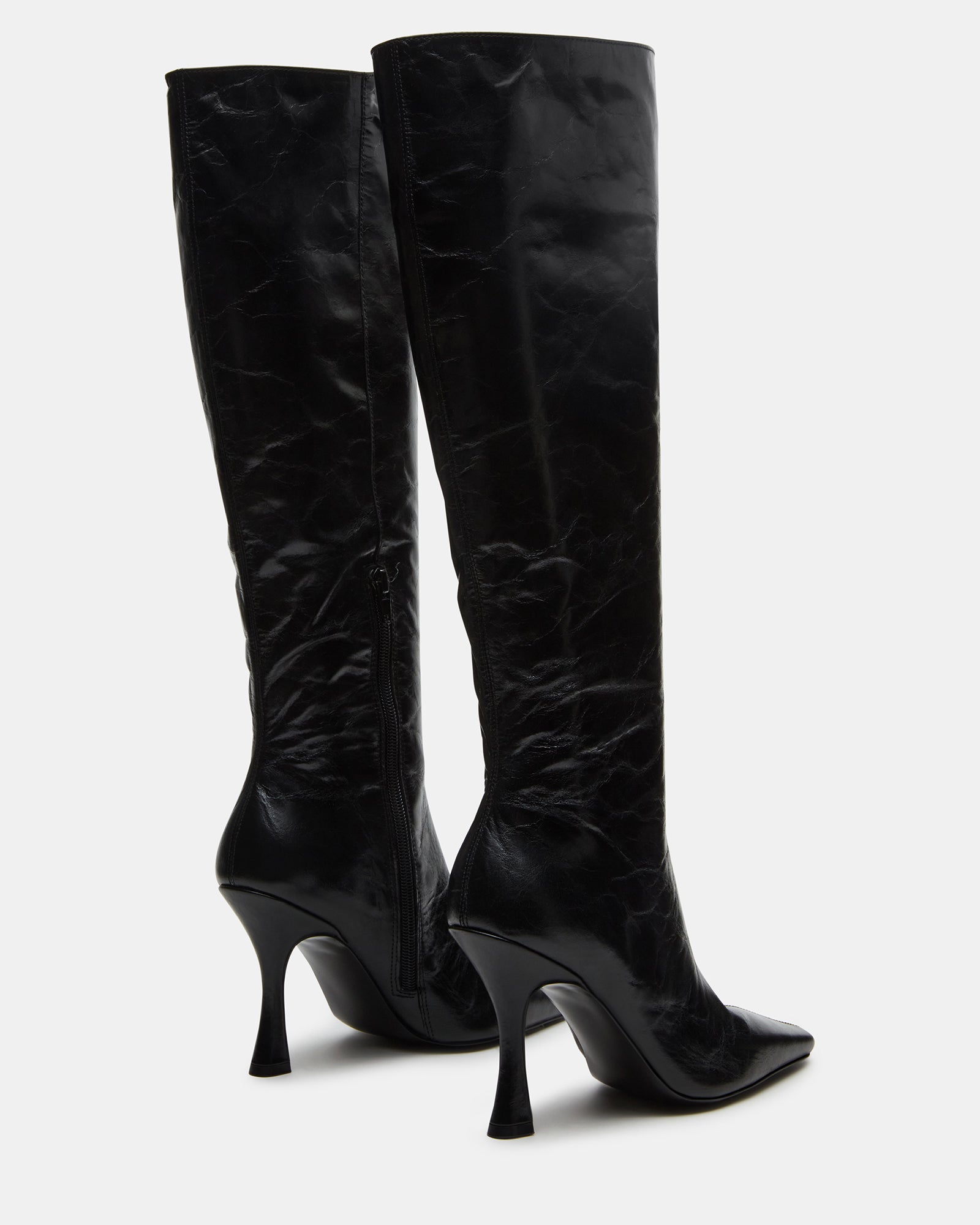 Faye Elegance black leather knee-high boots styled with a casual outfit.