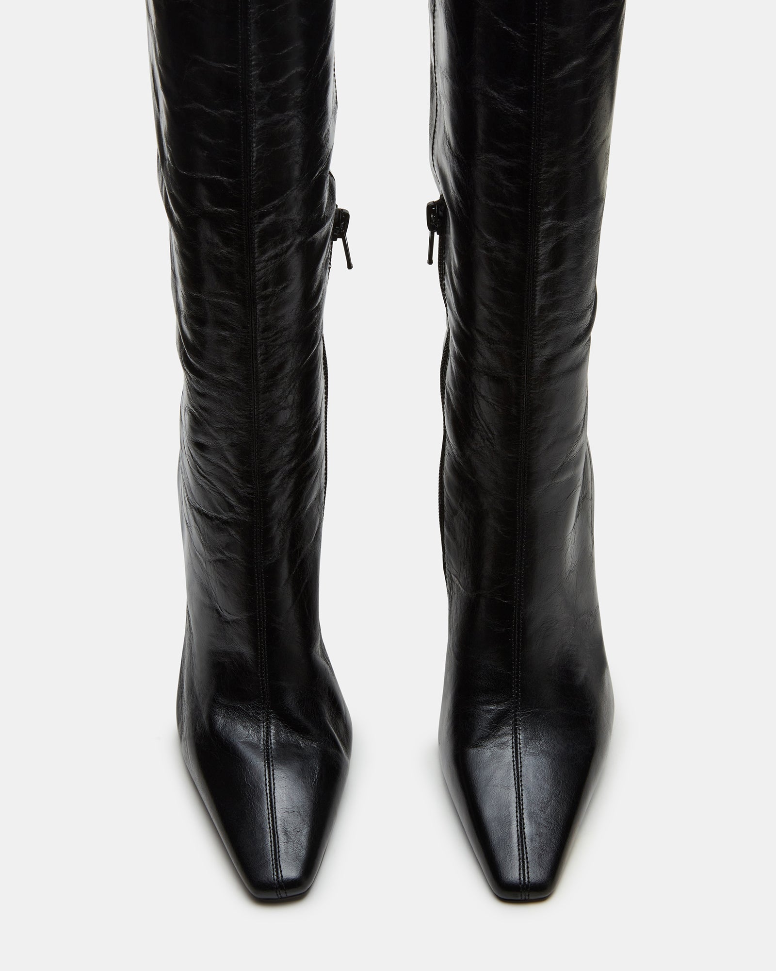Close-up of the inside zipper on Faye Elegance black leather knee-high boots.