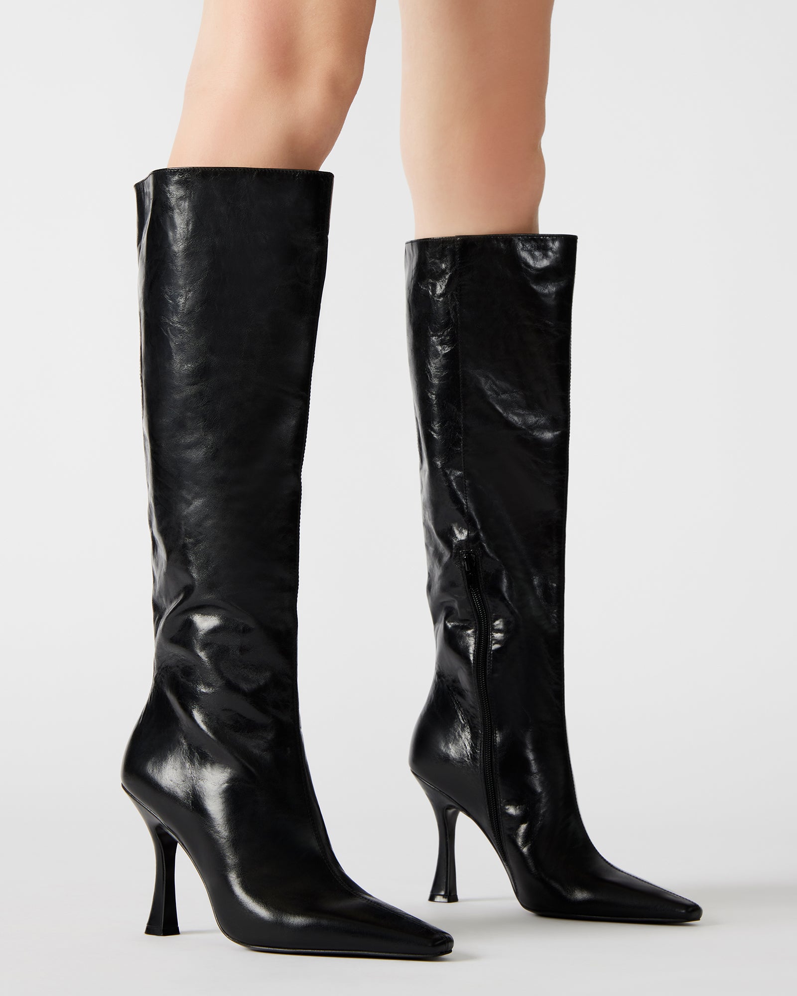 Close-up of the inside zipper on Faye Elegance black leather knee-high boots.