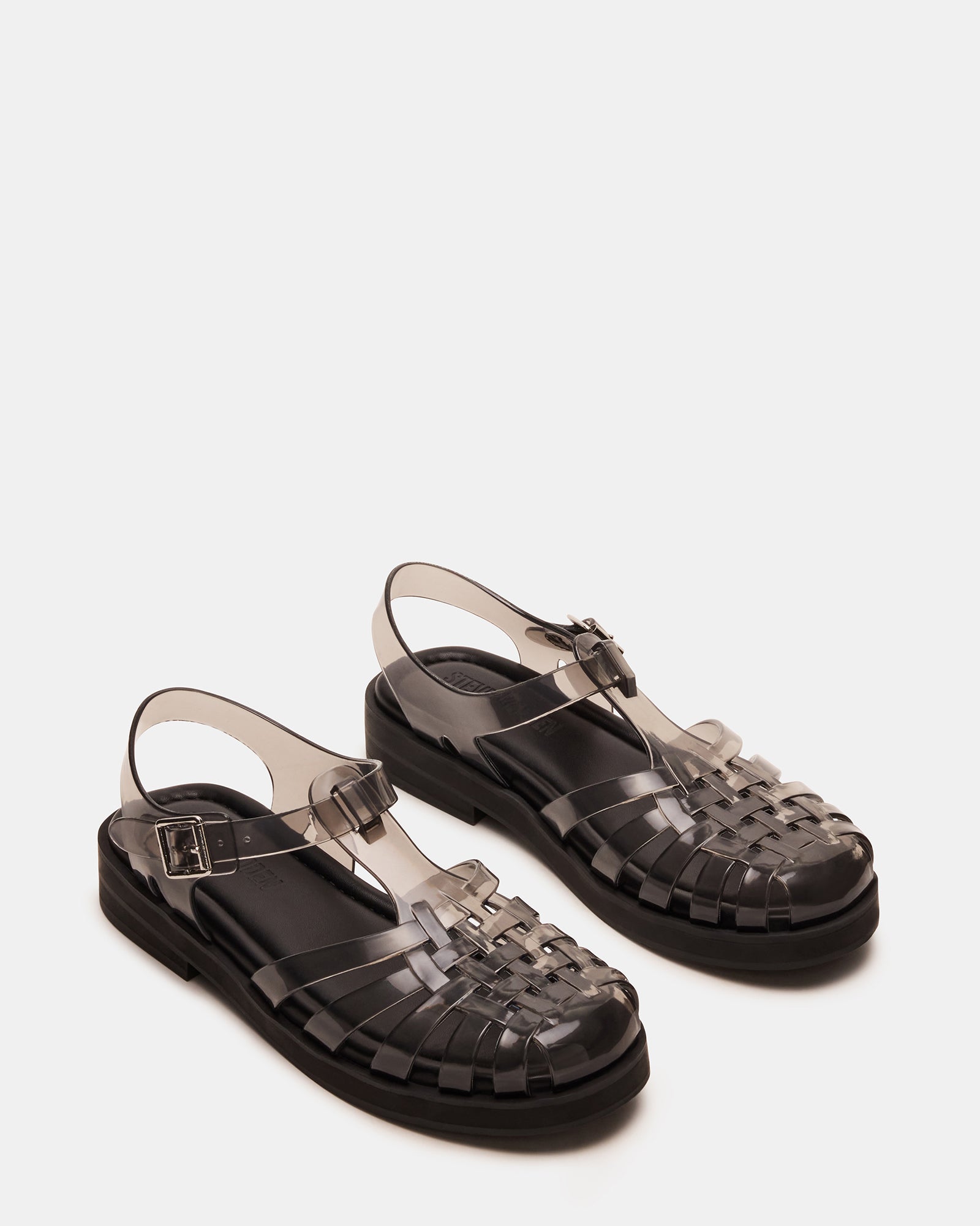 Close-up of Flicker sandals showing the rounded toe and PVC upper material.