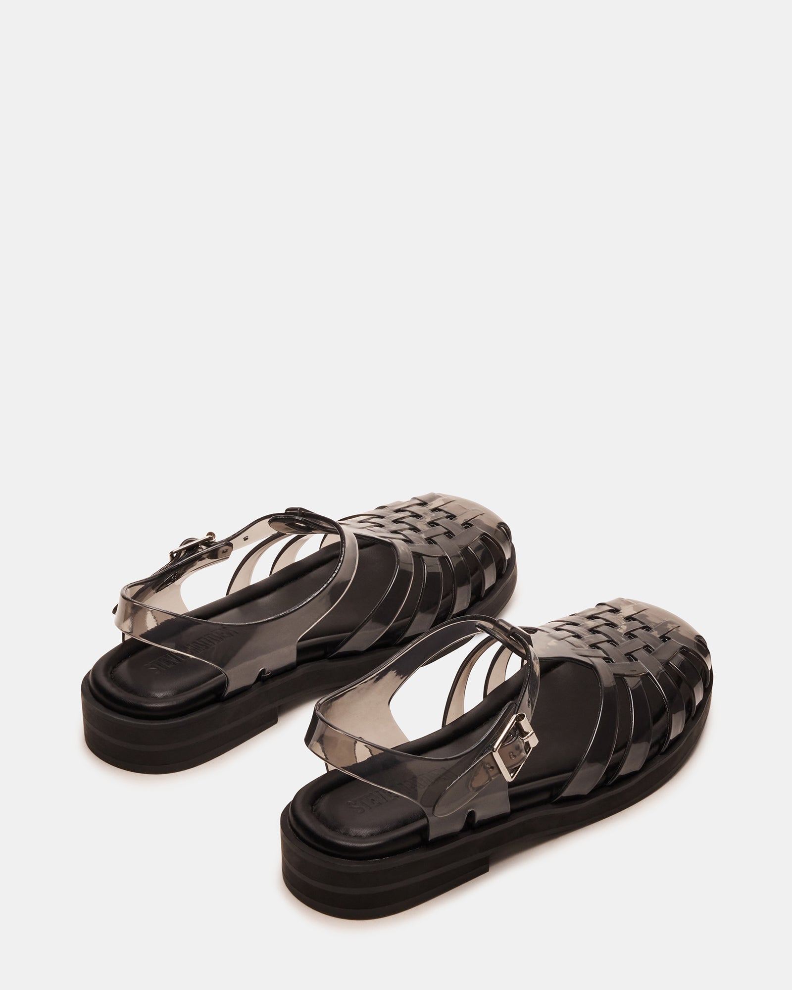 Close-up of Flicker sandals showing the rounded toe and PVC upper material.
