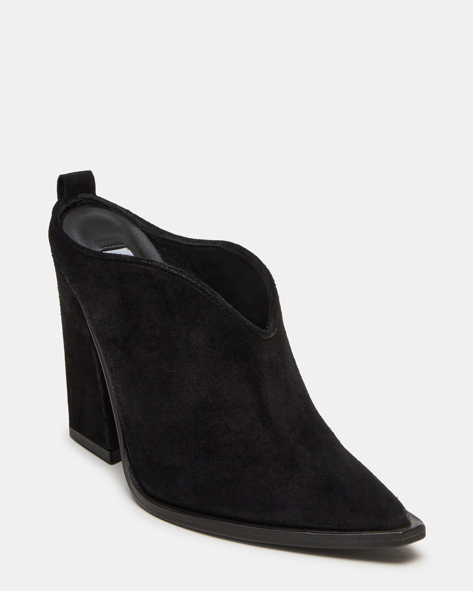 Close-up of suede texture and stitching detail on the brown suede heels from rear angle.