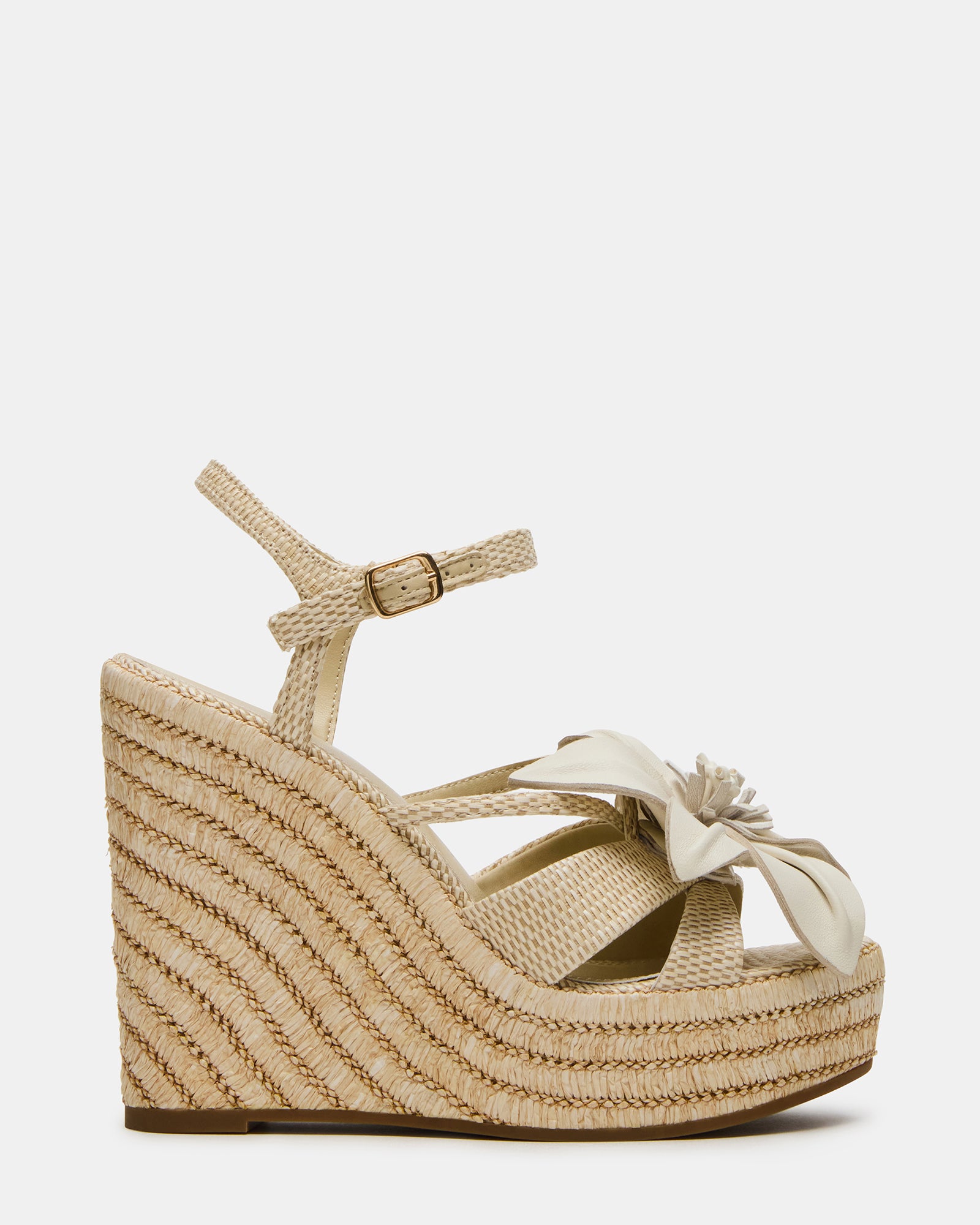 Close-up of Florentina 3D flower platform wedge sandals showcasing leather and raffia materials.